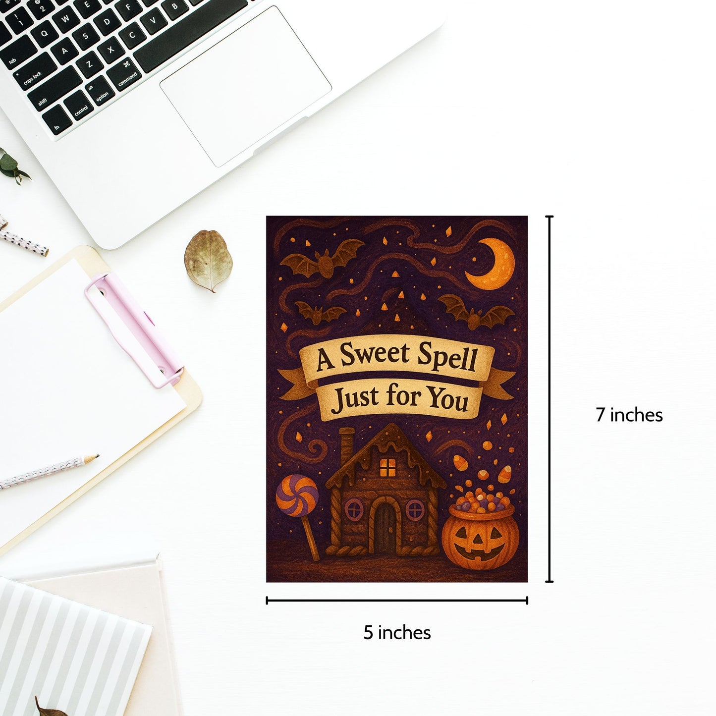 Halloween-themed card with decorative elements and measurements on a white surface.