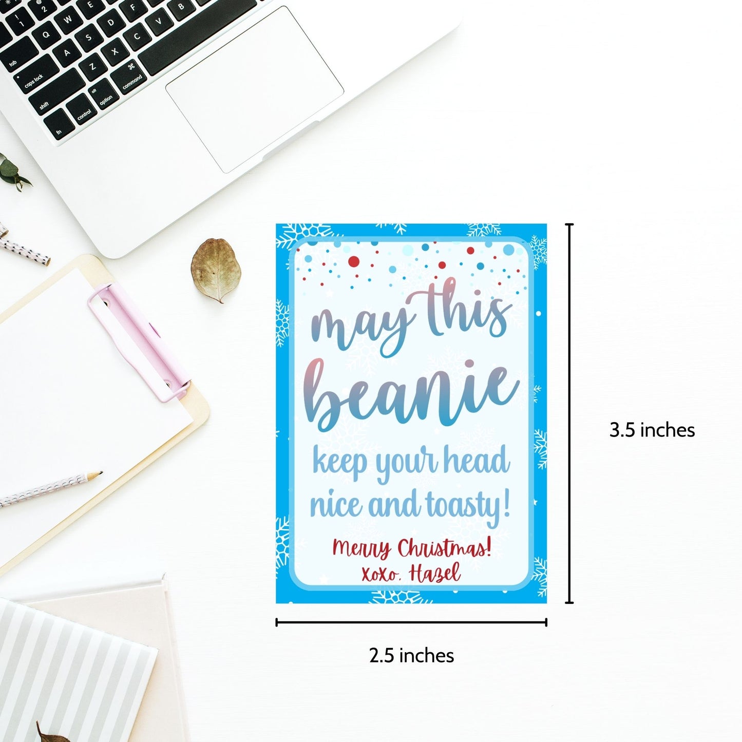 Holiday gift tags with a snowflake design for beanies or winter accessories, featuring the message "May This Beanie Keep Your Head Nice and Toasty." Includes printable PDF and editable Canva template.