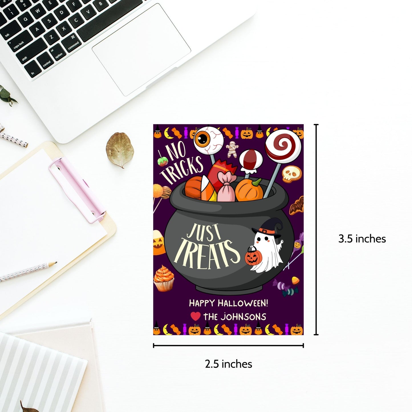 Halloween-themed printable gift tags with the message "No Tricks, Just Treats" featuring a cauldron filled with Halloween candies and treats. Tags are 2.5 x 3.5 inches, laid out 8 per sheet on a standard 8.5 x 11-inch page. Includes a printable PDF and a PDF with a link to an editable Canva template.