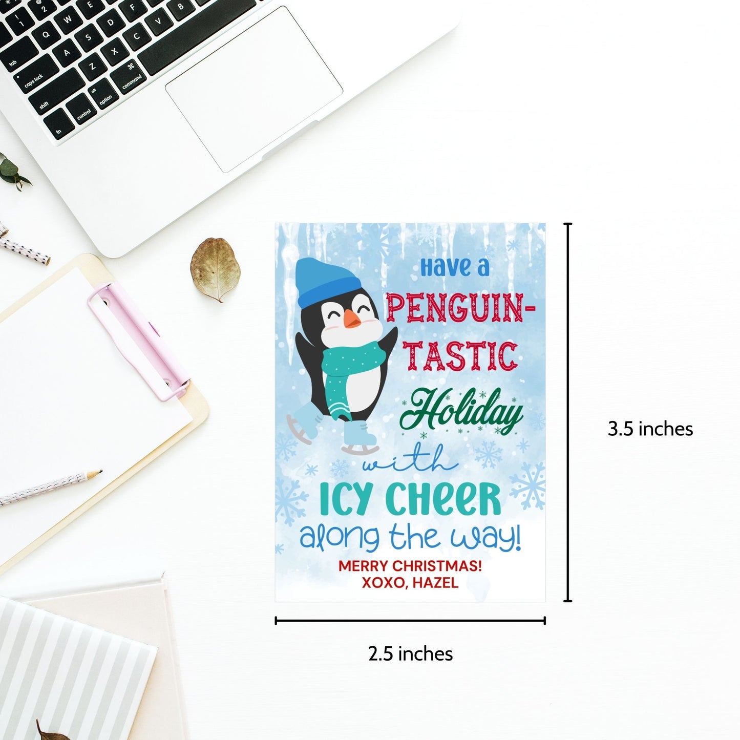 Penguin-themed Christmas gift tags featuring a happy penguin wearing a blue hat and green scarf, surrounded by snowflakes. The text reads 'Have a Penguin-tastic Holiday with Icy Cheer Along the Way!'