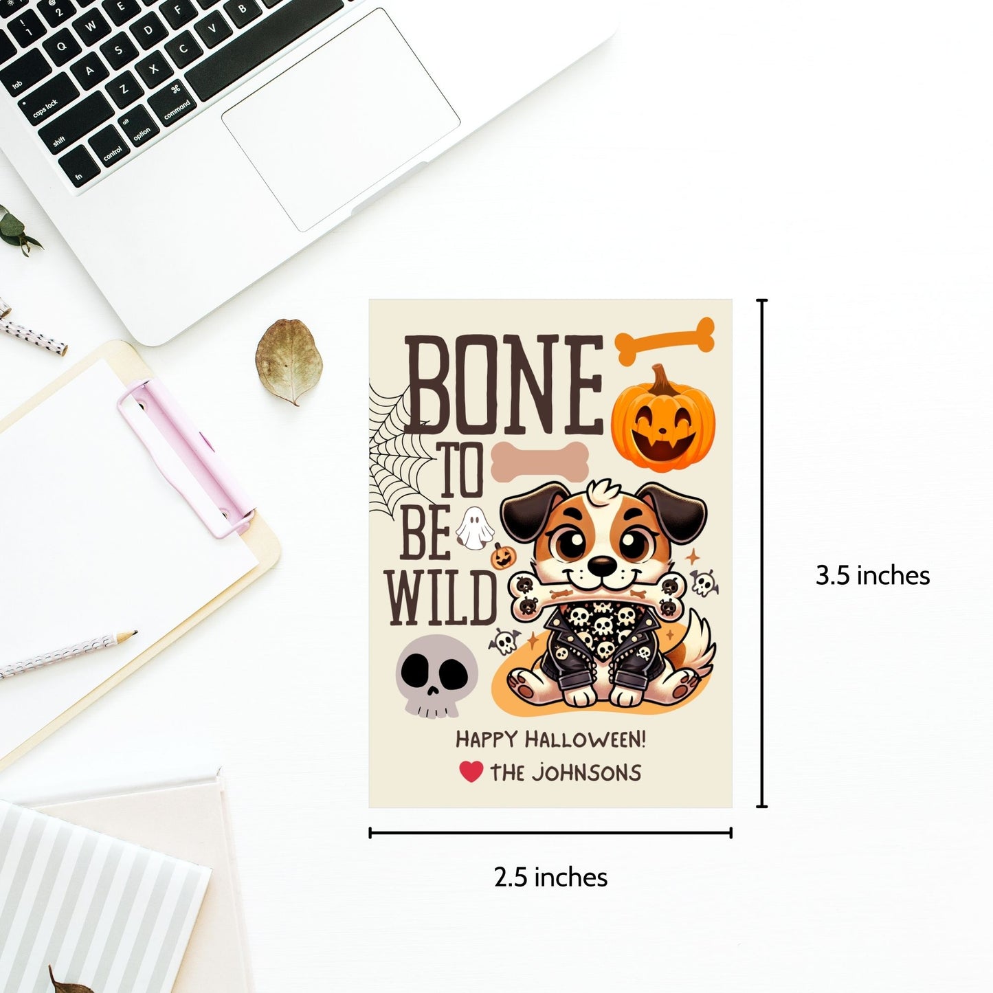 Printable dog-themed Halloween gift tags with the message "Bone to Be Wild." Featuring a playful dog in Halloween attire, these tags are 2.5 x 3.5 inches, laid out 8 per sheet on an 8.5 x 11-inch page. Includes a printable PDF and a PDF with a link to an editable Canva template.