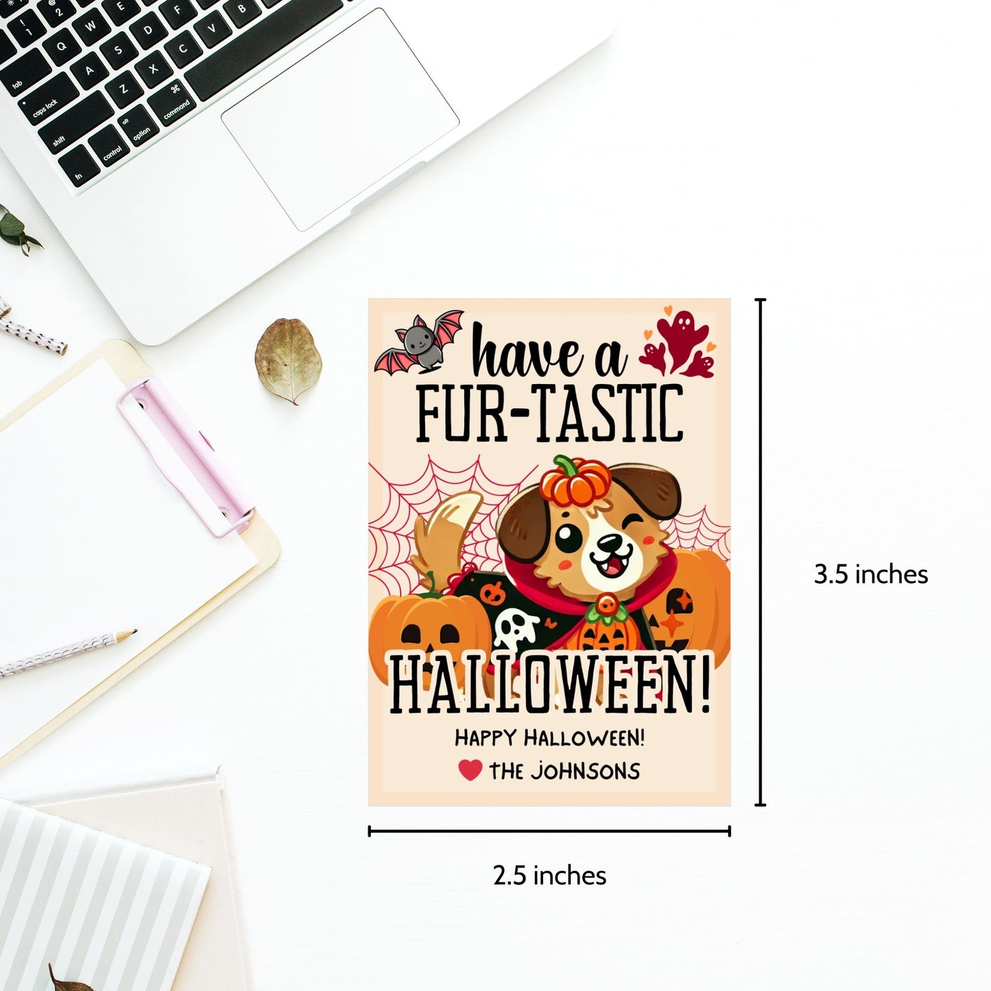 Printable dog-themed Halloween gift tags with the message "Have a Fur-Tastic Halloween!" featuring a cute dog in a pumpkin costume, bats, and pumpkins. The tags are 2.5 x 3.5 inches, laid out 8 per sheet on an 8.5 x 11-inch page. Includes a printable PDF and a link to an editable Canva template.