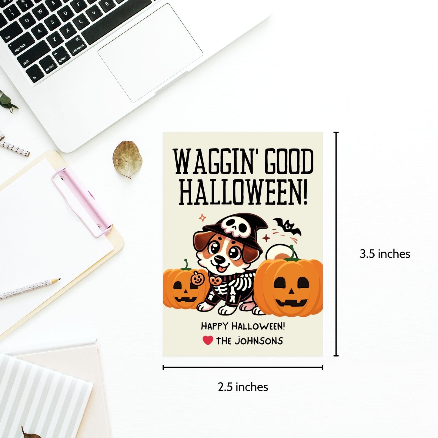 Dog-themed printable Halloween gift tags featuring an adorable dog dressed in a skeleton costume with pumpkins and the message "Waggin' Good Halloween!" Tags are 2.5 x 3.5 inches, laid out 8 per sheet on an 8.5 x 11-inch page. Includes a printable PDF and a PDF with a link to an editable Canva template.