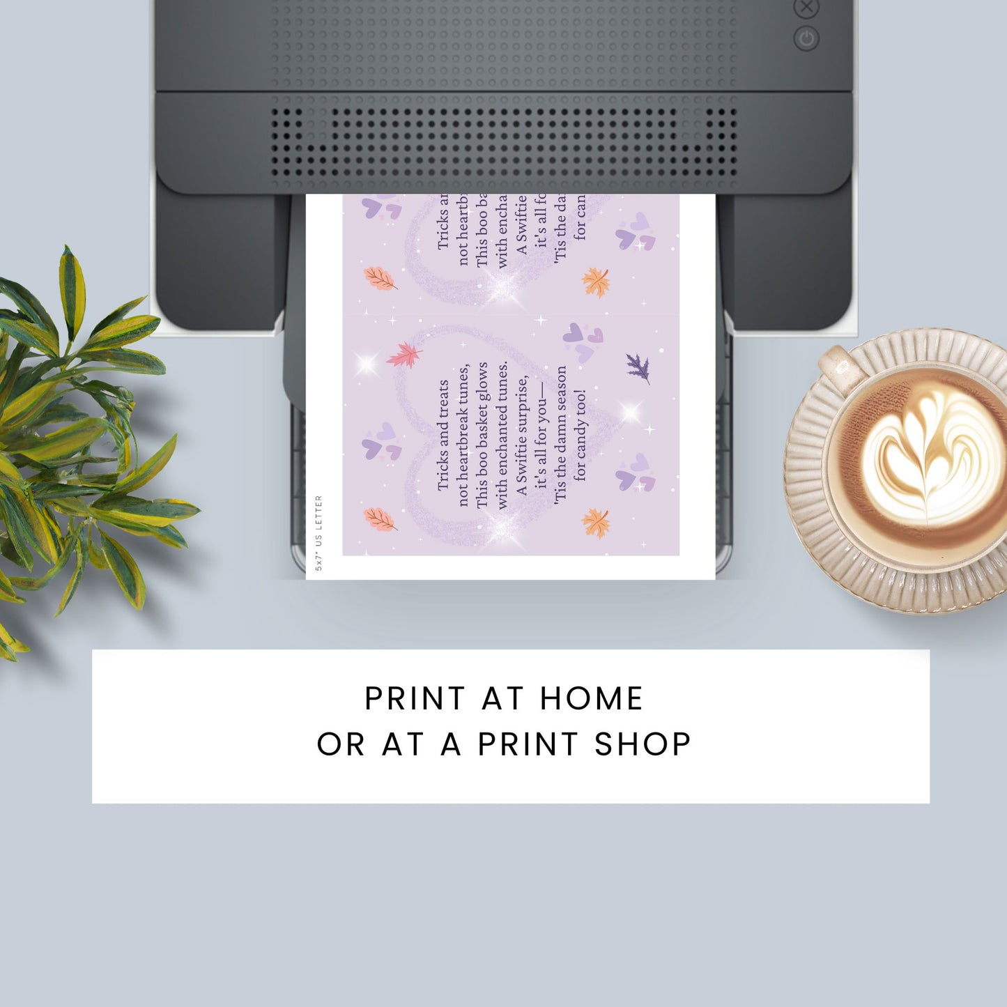Printer with a printed sheet, plant, and coffee cup on a light blue surface.