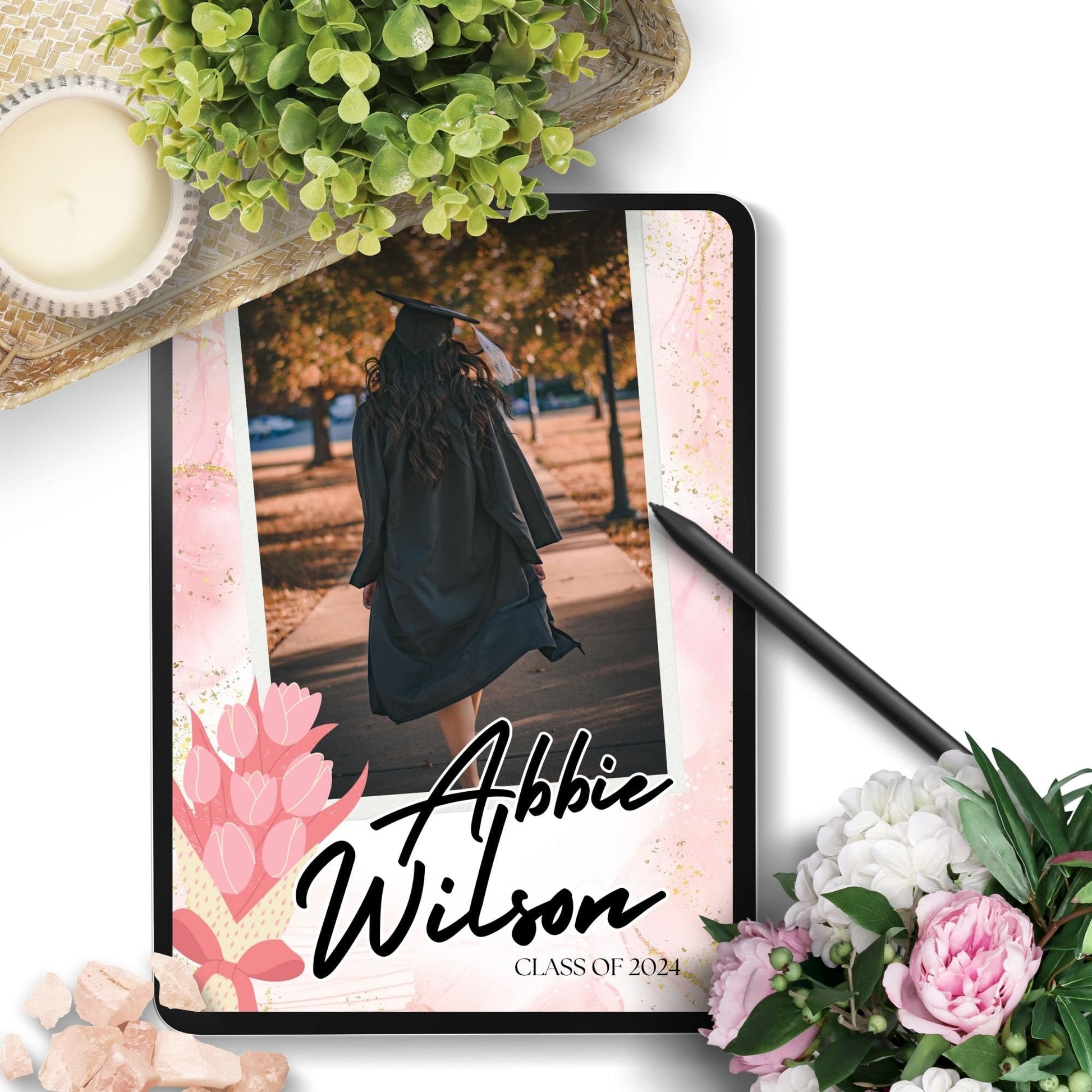 Elegant double-sided graduation party invitation with a vibrant front featuring a graduate walking and a detailed back with event specifics, all set against a charming pink watercolor background with floral motifs.