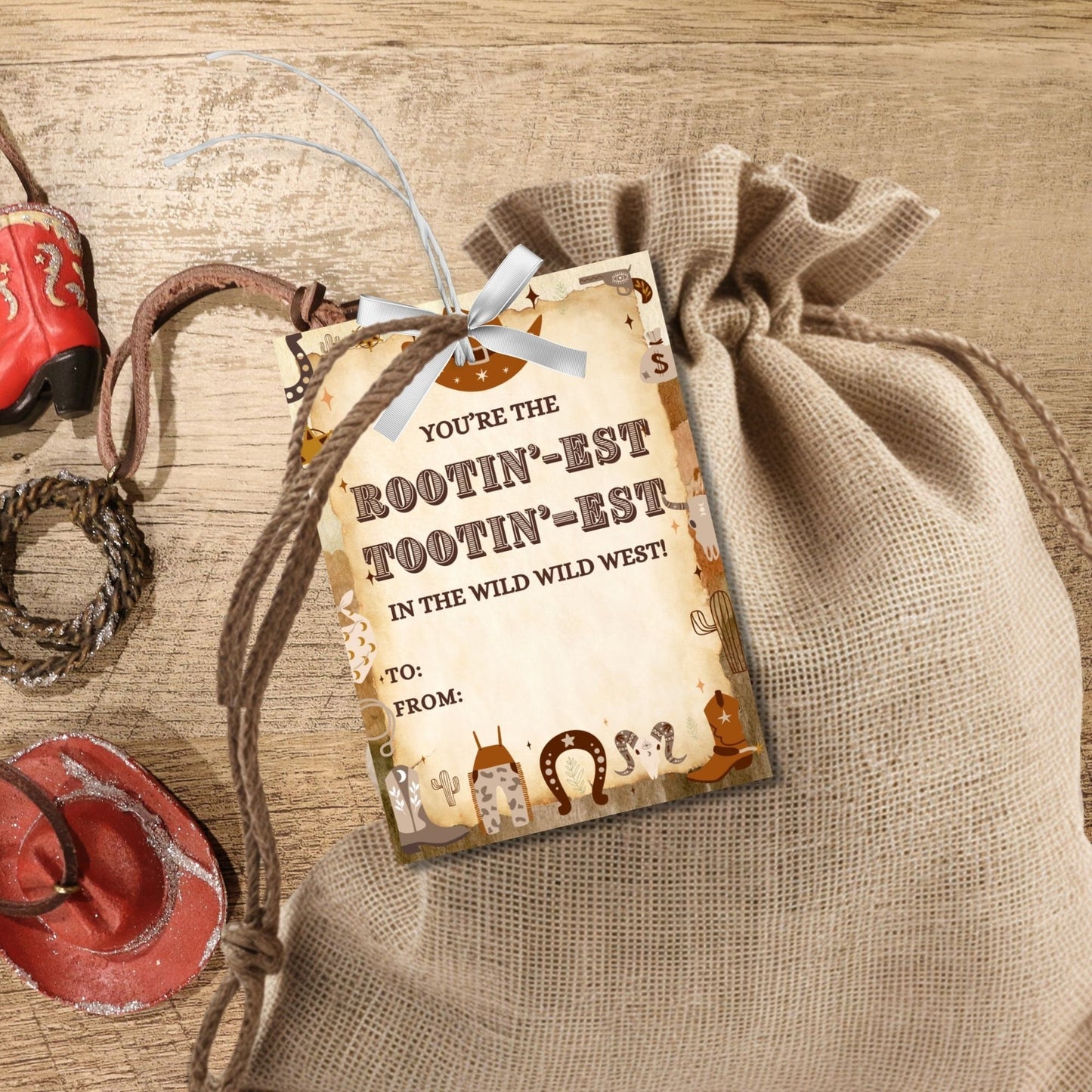 Image featuring YOURE THE ROOTIN-EST TOOTIN-EST IN THE WILD WILD WEST! Tags show gratitude with a Western theme and customizable names. Ideal for appreciation gifts to teachers, staff, and more.