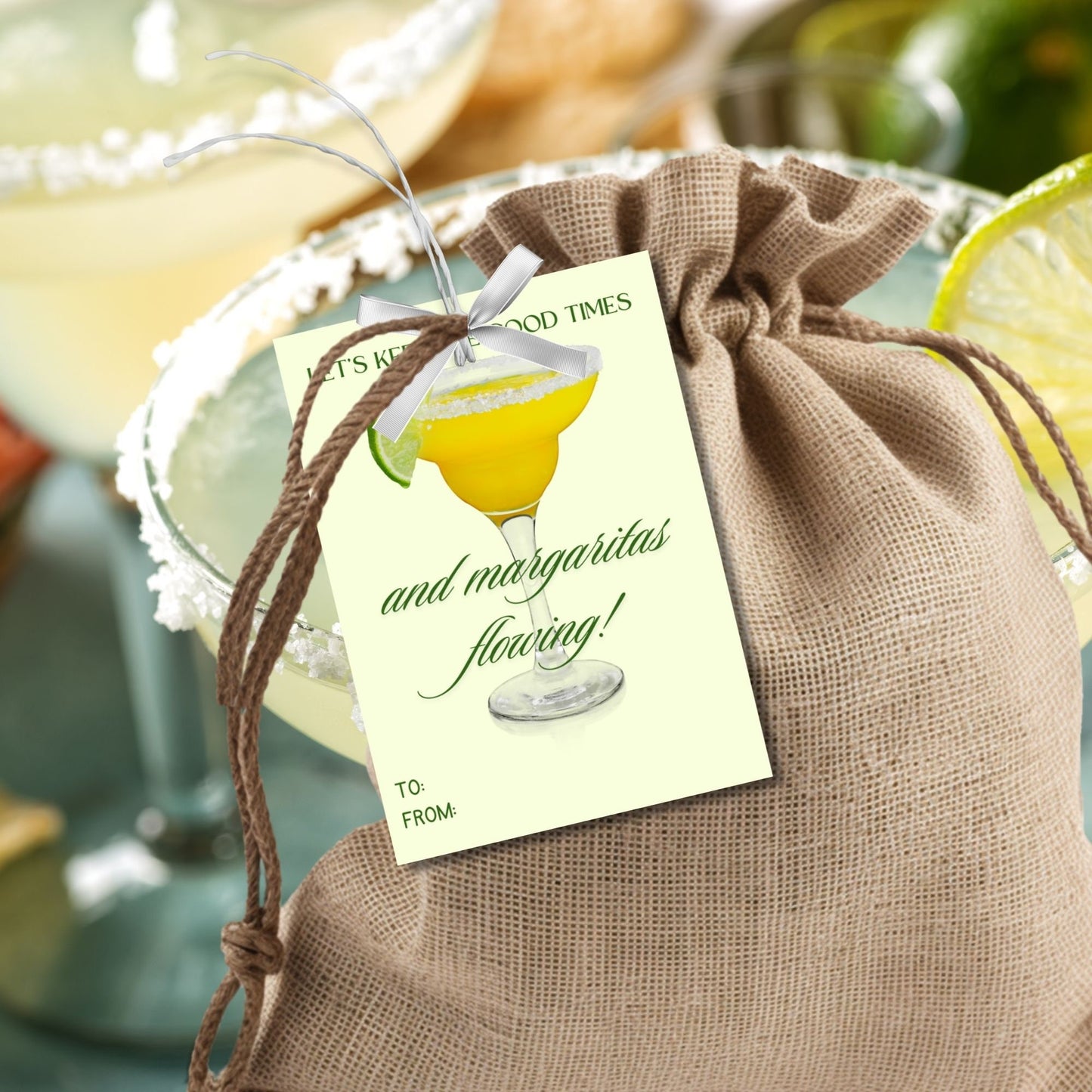 A sheet of light green gift tags with the text Lets keep the good times and margaritas flowing! in elegant green letters, featuring a margarita glass with a lime wedge and a customizable message that says Thank you for a great year! β€οΈ Taylor.