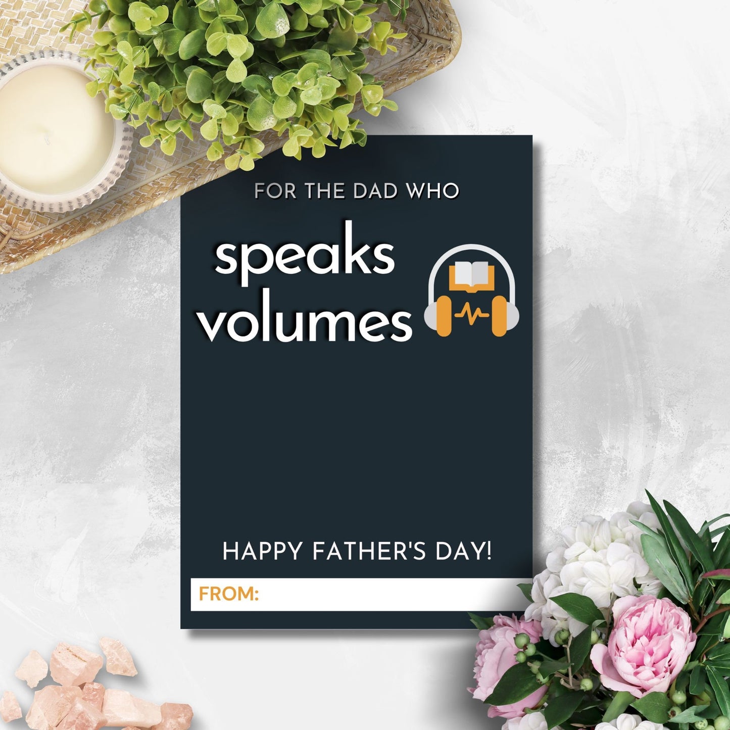 Fathers Day card with a For the dad who speaks volumes message, featuring headphones over a book, ideal for pairing with an Audible gift card.
