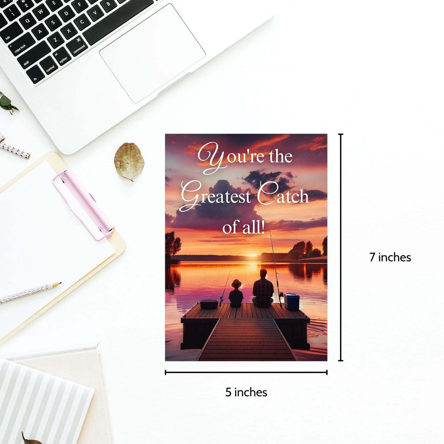 Father's Day printable card with the message Youre the Greatest Catch of all! over a serene sunset fishing scene, sized 5x7 inches, laid out on an 8.5x11 inch sheet, featuring two cards for easy home printing.