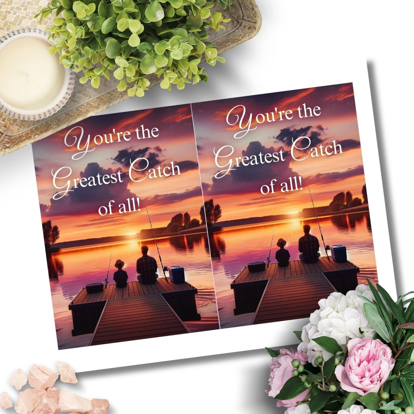 Father's Day printable card with the message Youre the Greatest Catch of all! over a serene sunset fishing scene, sized 5x7 inches, laid out on an 8.5x11 inch sheet, featuring two cards for easy home printing.