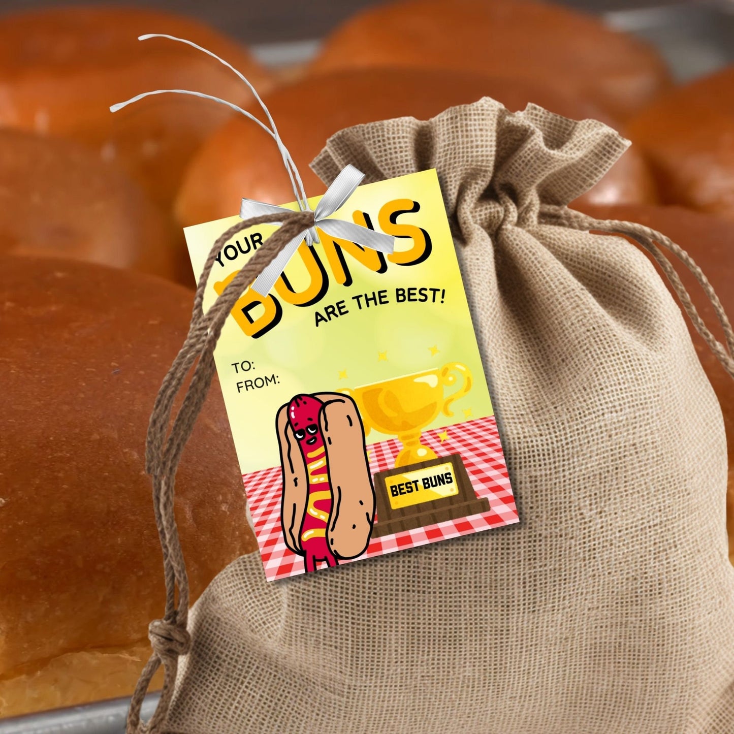 Eight buns-themed Fathers Day gift tags displayed in two rows of four. Each tag features a message about dad having the best buns, with a customizable name slot and an illustration of a hot dog with a Best Buns trophy.