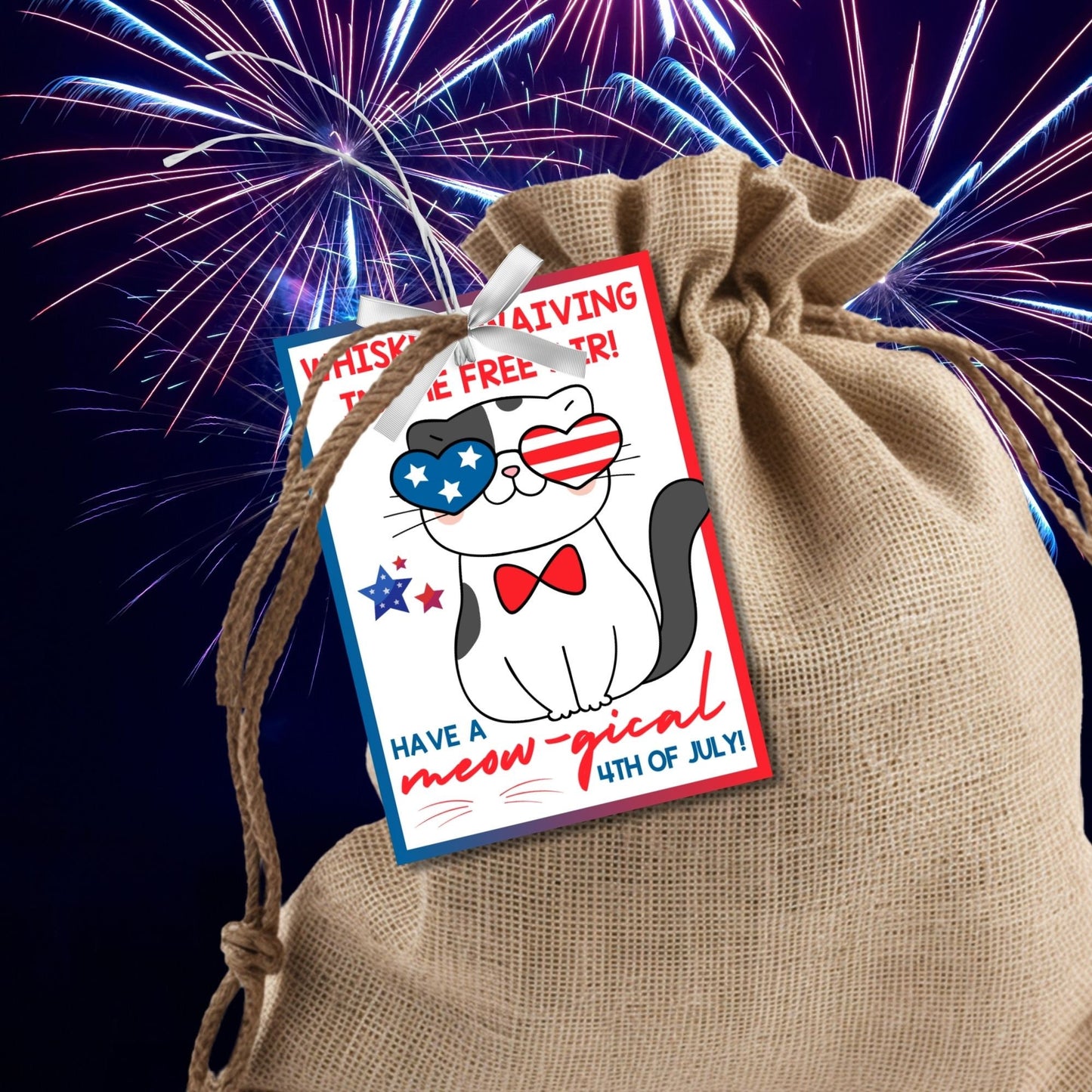 Festive 4th of July printable gift tags featuring patriotic colors, a cute cat with American flag glasses, and the message Whiskers Waiving in the Free Air! Have a Meow-gical 4th of July! Perfect for party favors and gifts.