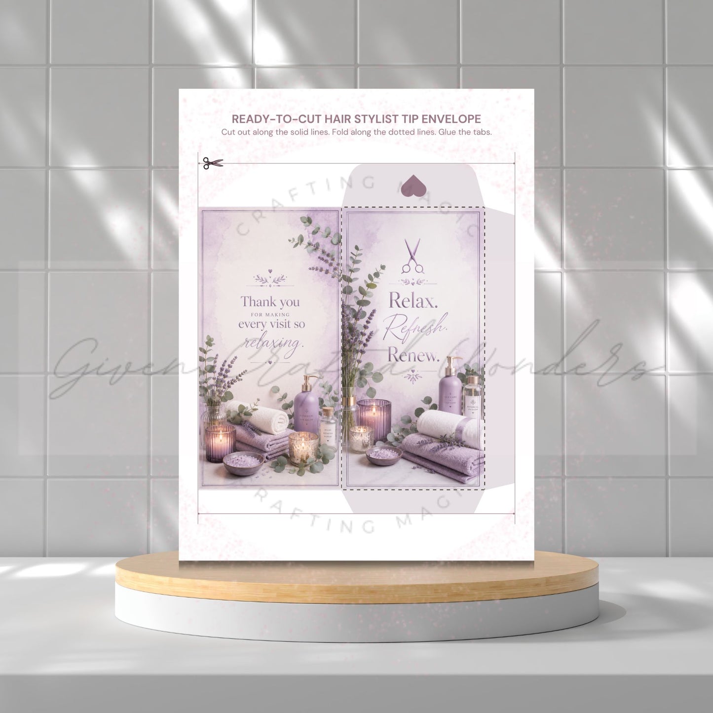 A printed hair stylist tip envelope template displayed upright on a round wooden pedestal against a light gray tiled wall. The card features a lavender spa-themed design with illustrations of lavender flowers, candles, and rolled towels, plus text such as 'Relax', 'Right', and 'Believe.