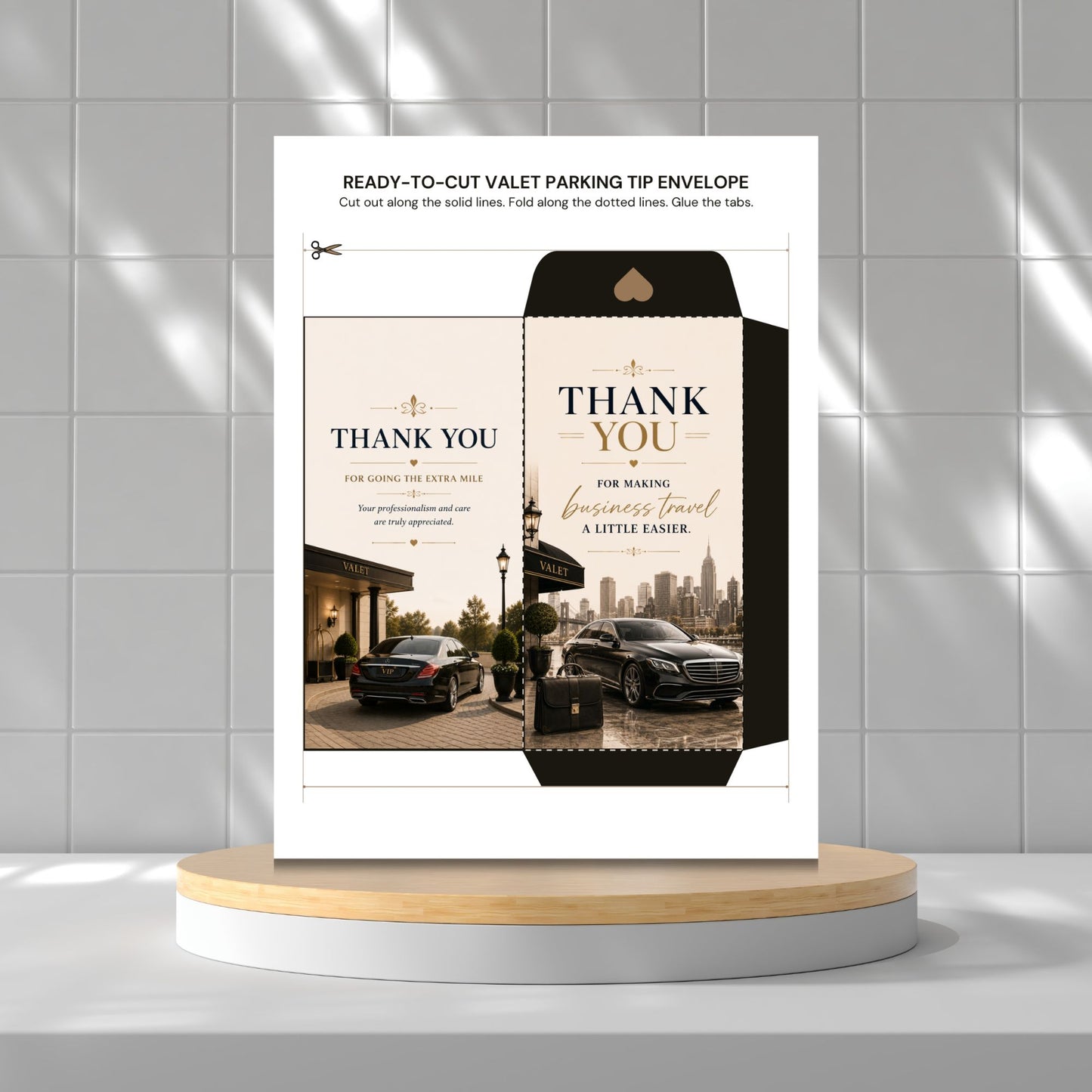 A printed valet parking tip envelope card displayed upright on a round pedestal against a light gray tiled wall. The card shows a black-and-beige 'THANK YOU' design with car photos and small instructional text at the top.