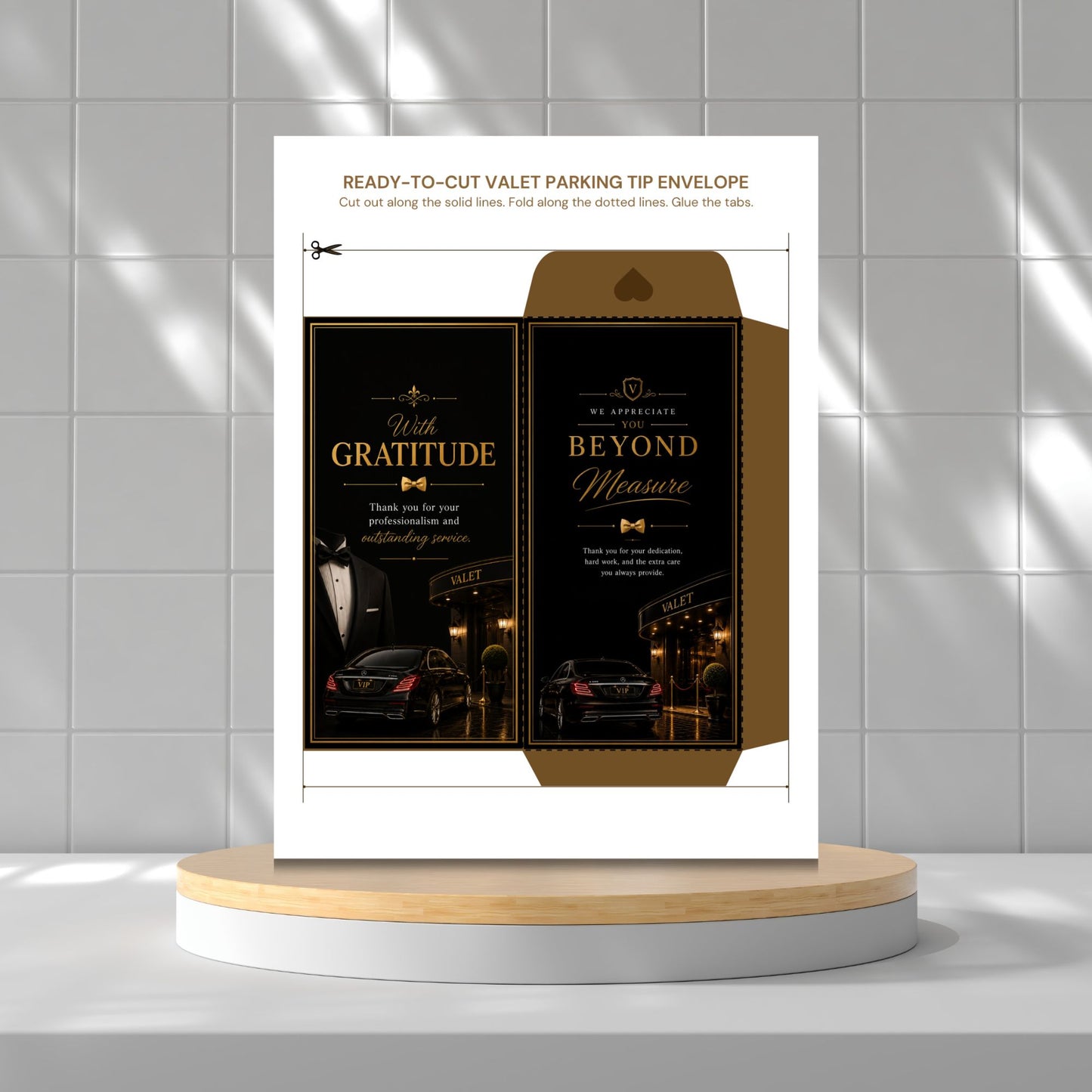 A printed valet parking tip envelope template shown standing on a round pedestal against a tiled wall. The design features a white outer sheet with an illustrated and cut-out inner envelope in black and gold, with text such as 'Ready-to-Cut Valet Parking Tip Envelope' and decorative phrases like 'With Gratitude' and 'Beyond Measure.