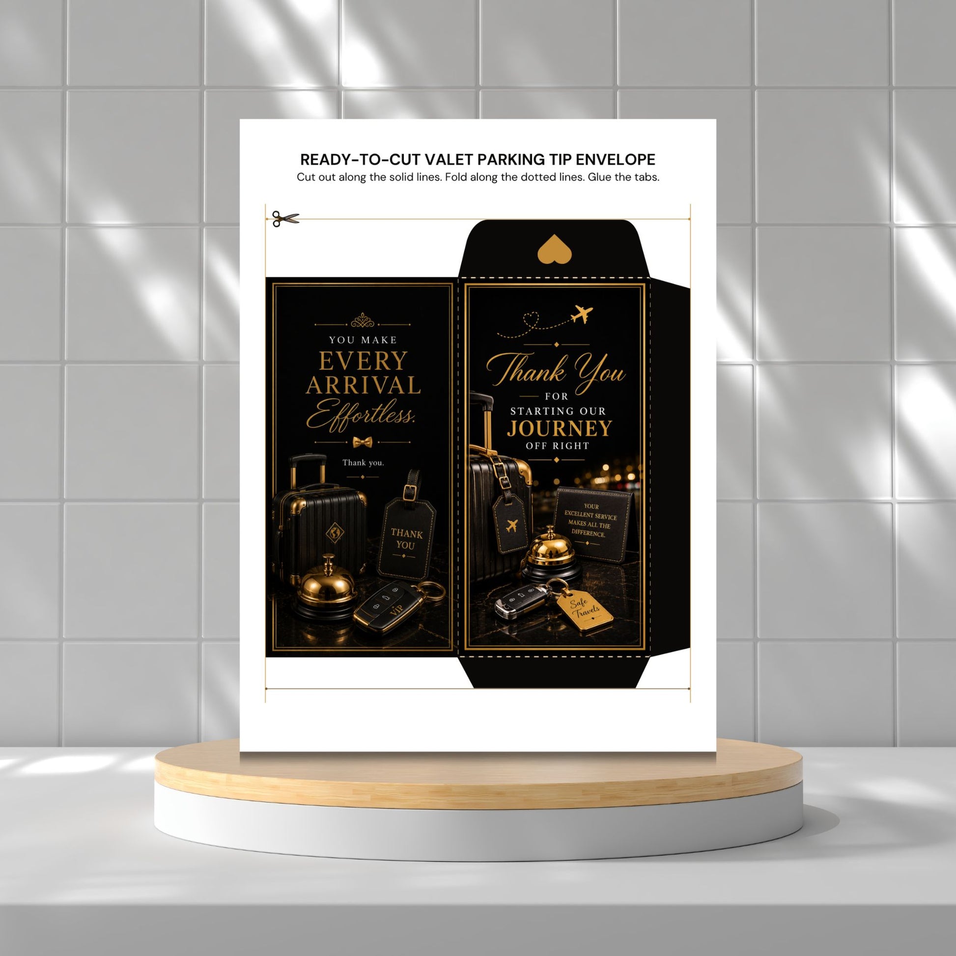 A printed ready-to-cut valet parking tip envelope template shown standing on a round wooden platform against a light gray tiled wall. The design is predominantly black and gold with decorative illustrations of suitcases, a briefcase, and a gold key, and text including 'Every Arrival Effortless' and 'Thank You for Your Journey.