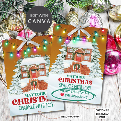 Christmas gift tags featuring a cozy snow-covered house decorated with festive lights, paired with the message "May Your Christmas Sparkle with Joy!" These printable and editable tags add a warm and festive touch to holiday gifts.