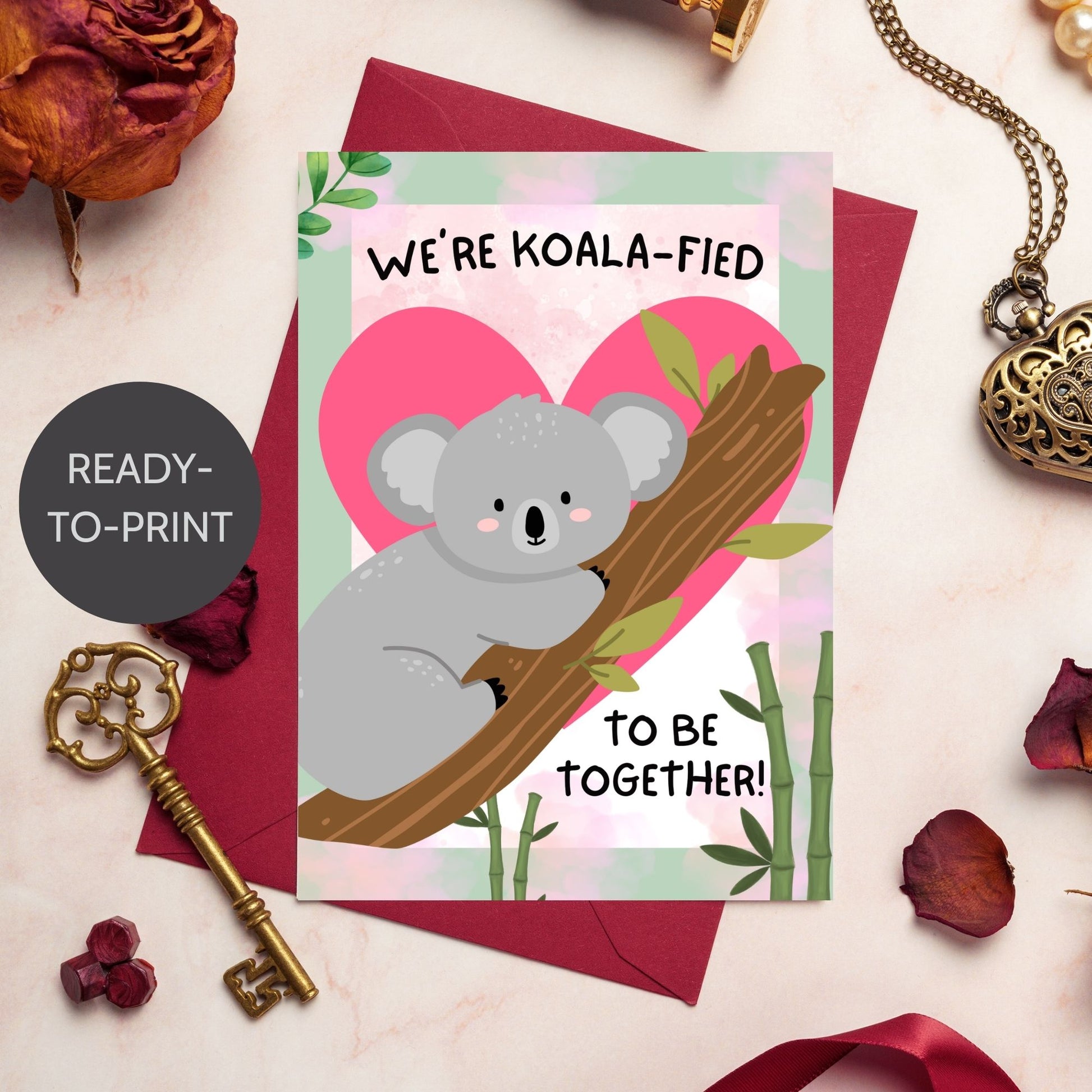 Printable Valentine’s Day Greeting Card featuring the phrase “We’re Koalafied to Be Together” with a koala design. Designed as a 5x7 PDF on an 8.5 x 11 sheet with two cards per page. A cute and punny Valentine’s card for loved ones.