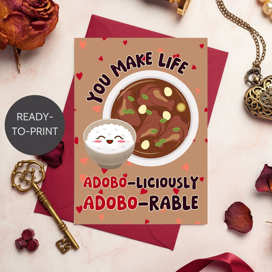 Printable Valentine’s Day card featuring the phrase “You Make Life Adoboliciously Adoborable” with a fun Adobo-themed design. Designed as a 5x7 PDF on an 8.5 x 11 sheet with two cards per page. A punny and heartfelt Valentine’s card for Filipino food lovers.