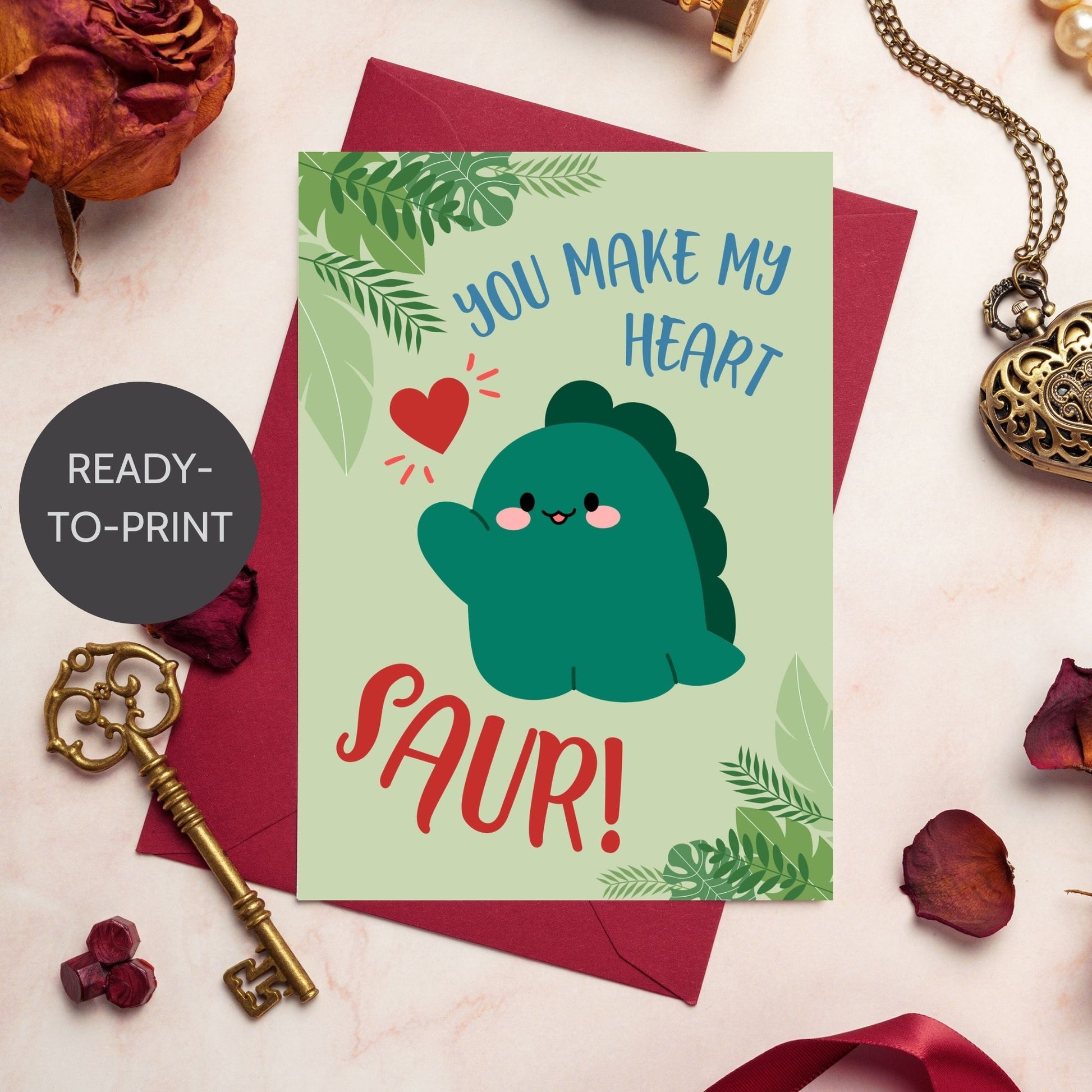 Printable Valentine’s Day Greeting Card featuring the pun “You Make My Heart Saur.” Designed as a 5x7 PDF on an 8.5 x 11 sheet with two cards per page. A fun and adorable Valentine’s card for dinosaur lovers!