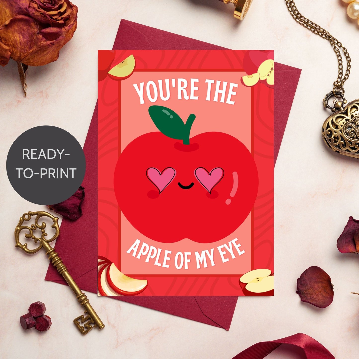 Printable Valentine’s Day Greeting Card featuring the phrase “You’re the Apple of My Eye” with an apple design. Designed as a 5x7 PDF on an 8.5 x 11 sheet with two cards per page. A sweet and timeless Valentine’s card for loved ones.