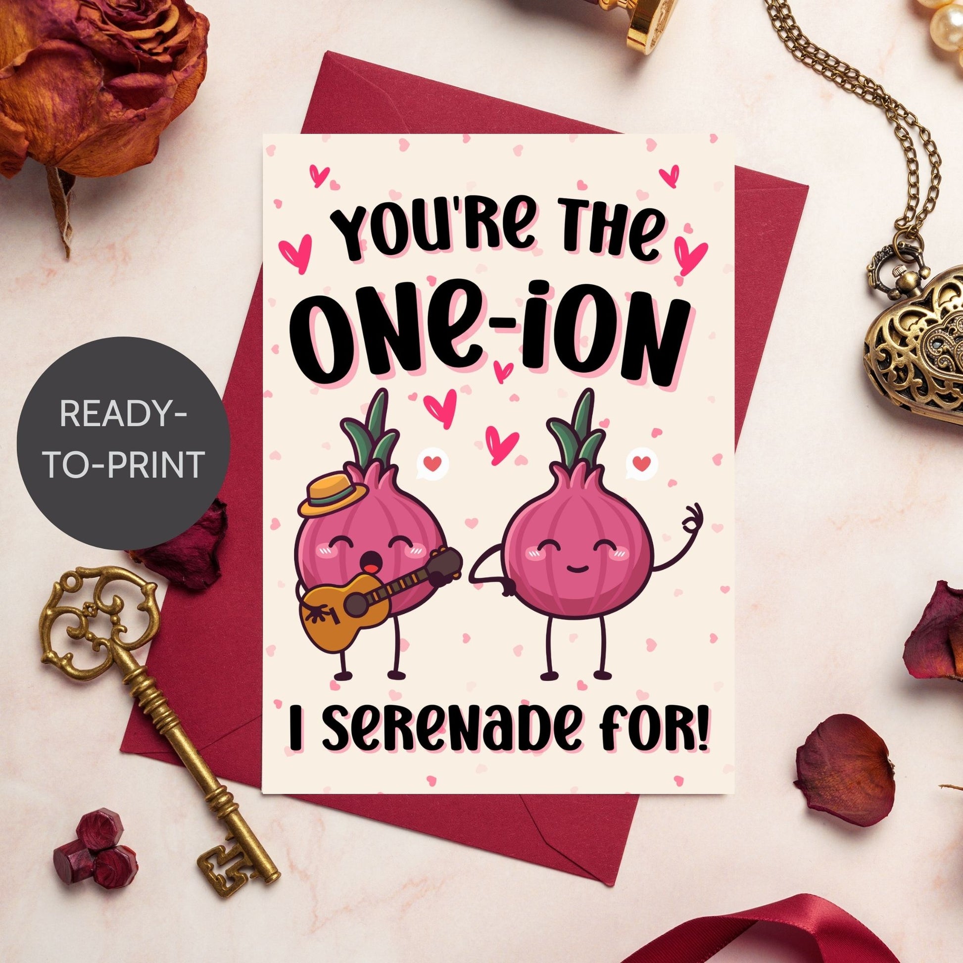 Printable Valentine’s Day Greeting Card featuring the phrase “You’re the One-ion a Serenade For” with a playful onion illustration. Designed as a 5x7 PDF on an 8.5 x 11 sheet with two cards per page. A punny and charming Valentine’s card for loved ones.