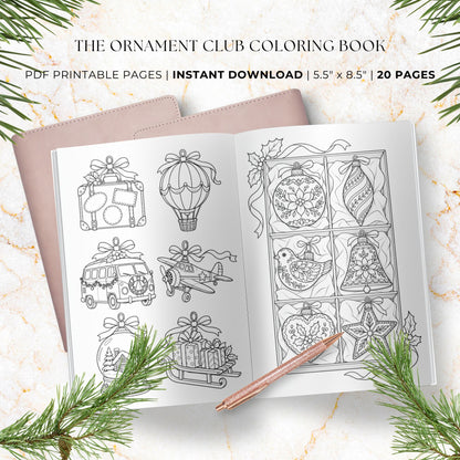 The Ornament Club Coloring Book instant download PDF pages shown as a black-and-white printable coloring book cover with festive holiday illustrations including ornaments, a hot air balloon, a van, an airplane, a bird, and a sleigh. The pages are displayed on a light marble surface with pine branches and a rose gold pen.