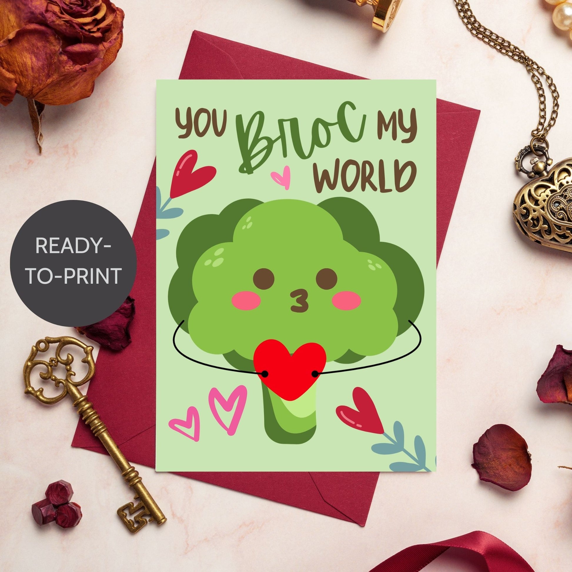 Printable Valentine’s Day Greeting Card featuring the phrase “You Broc My World” with a fun broccoli design. Designed as a 5x7 PDF on an 8.5 x 11 sheet with two cards per page. A punny and veggie-themed Valentine’s card for loved ones.