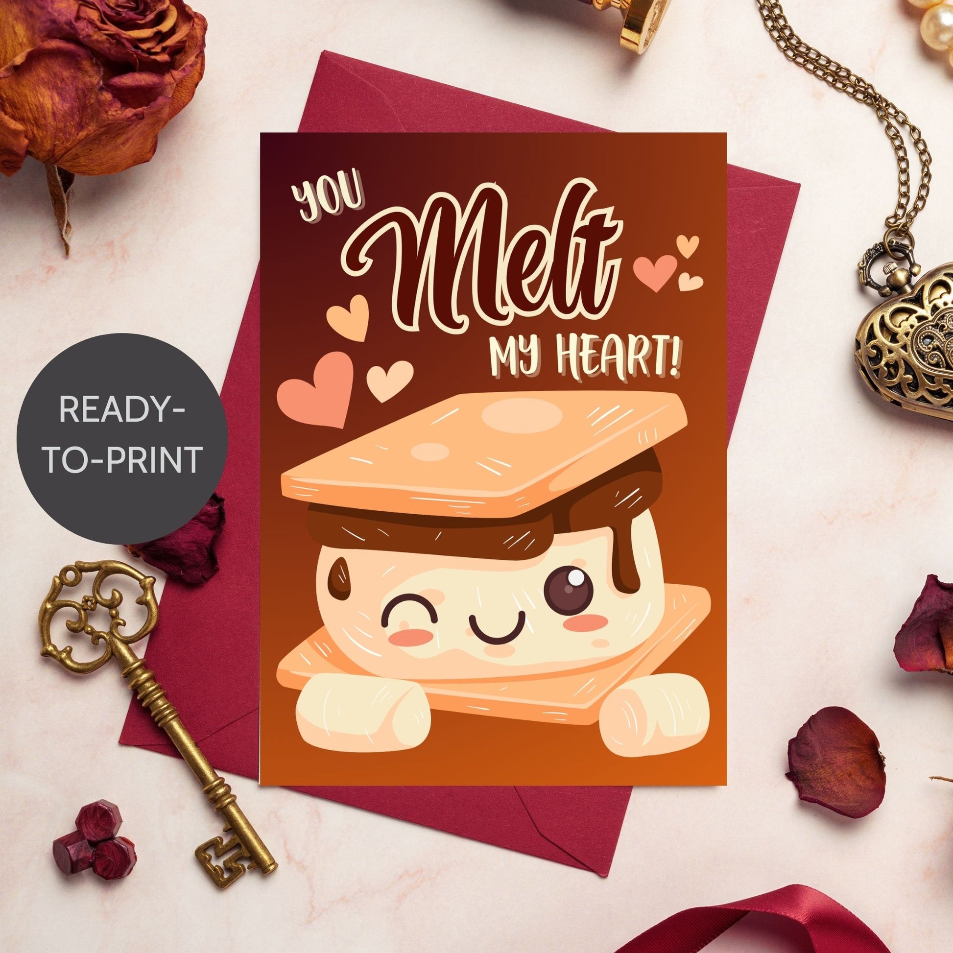 Printable Valentine’s Day Greeting Card featuring the phrase “You Melt My Heart” with a s’mores theme. Designed as a 5x7 PDF on an 8.5 x 11 sheet with two cards per page. A cute and cozy Valentine’s card for food lovers.