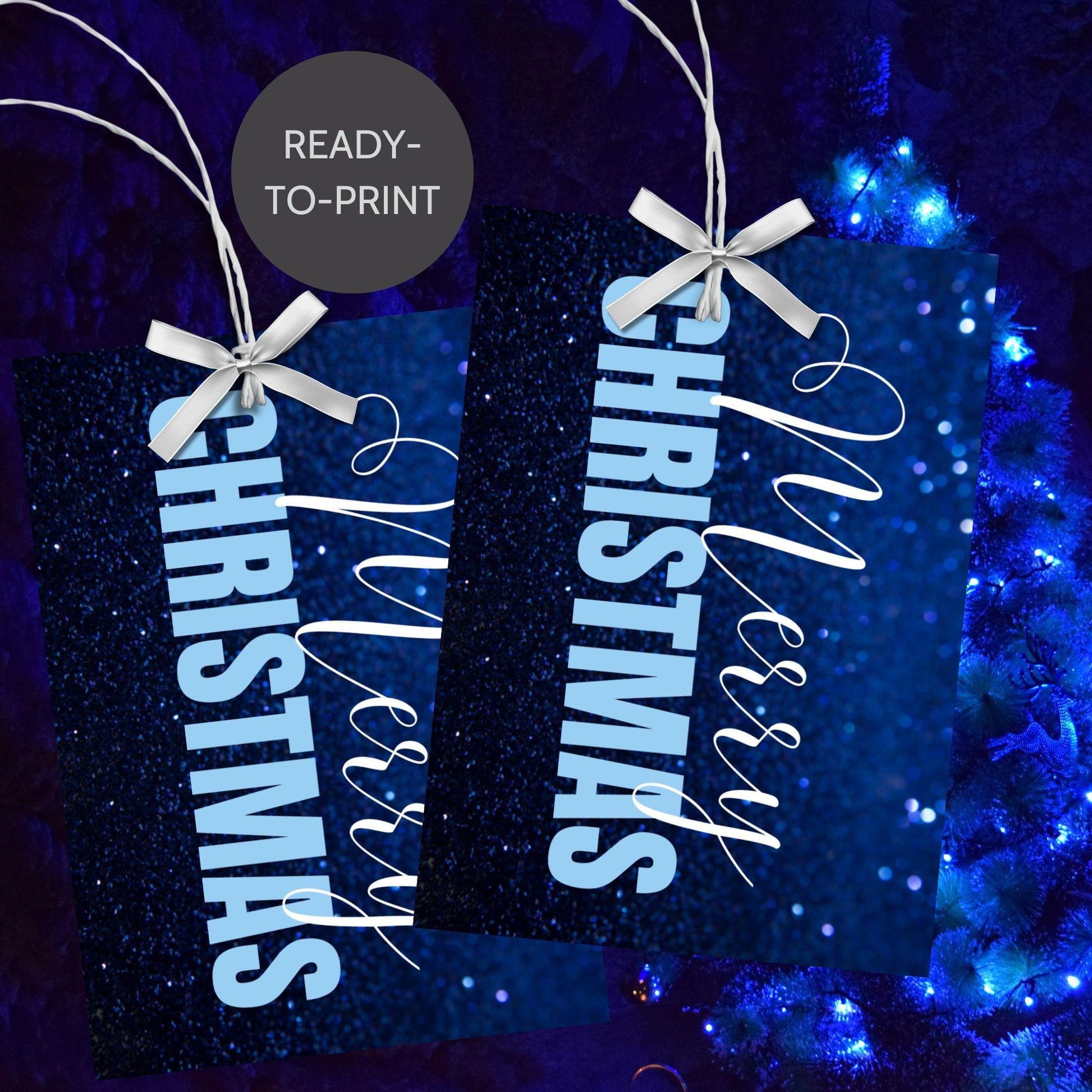 Printable blue Christmas gift tags with a glittery blue background and bold light blue "Merry Christmas" text, sized 2.5 x 3.5 inches, 8 tags per sheet.