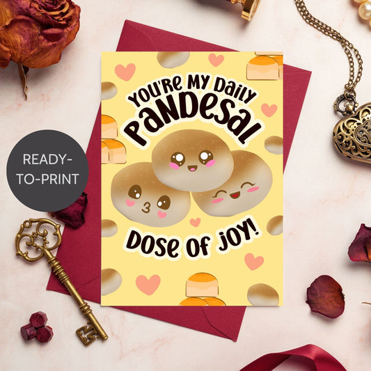 Printable Valentine’s Day card featuring the phrase “You’re My Daily Pandesal Dose of Joy” with a cute and warm pandesal design. Designed as a 5x7 PDF on an 8.5 x 11 sheet with two cards per page. A punny and heartfelt Valentine’s card for Filipino food lovers.