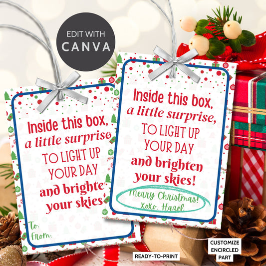 Festive holiday gift tags with the message, "Inside this box, a little surprise, to light up your day and brighten your skies." Includes printable PDF and editable Canva template.