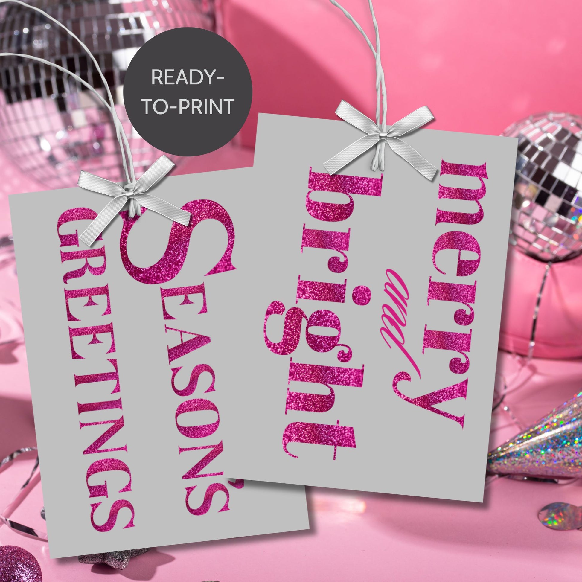 A set of ready-to-print Christmas gift tags featuring magenta glitter text on a silver-gray background with festive messages like "Merry and Bright" and "Season's Greetings." Each tag is sized at 2.5 x 3.5 inches, perfect for modern holiday gifting.