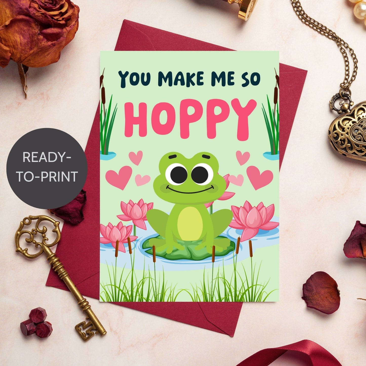 Printable Valentine’s Day Greeting Card featuring the pun “You Make Me So Hoppy.” Designed as a 5x7 PDF on an 8.5 x 11 sheet with two cards per page. A fun and cute Valentine’s card for frog lovers.