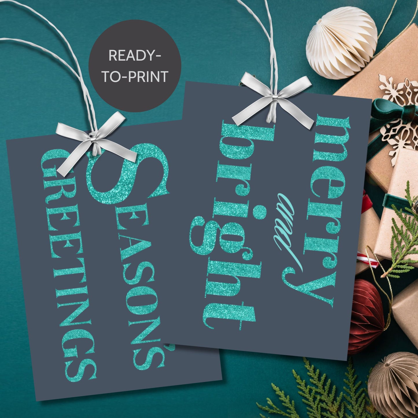 A set of ready-to-print Christmas gift tags featuring glittering turquoise text on a navy-blue background with festive messages like "Merry and Bright" and "Season's Greetings." Each tag is 2.5 x 3.5 inches, perfect for adding a vibrant touch to holiday gifting.