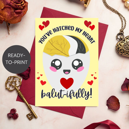 Printable Valentine’s Day card featuring the phrase “You’ve Hatched My Heart Balutifully” with a fun and unique balut (Filipino delicacy) design. Designed as a 5x7 PDF on an 8.5 x 11 sheet with two cards per page. A punny and heartfelt Valentine’s card for Filipino food lovers.