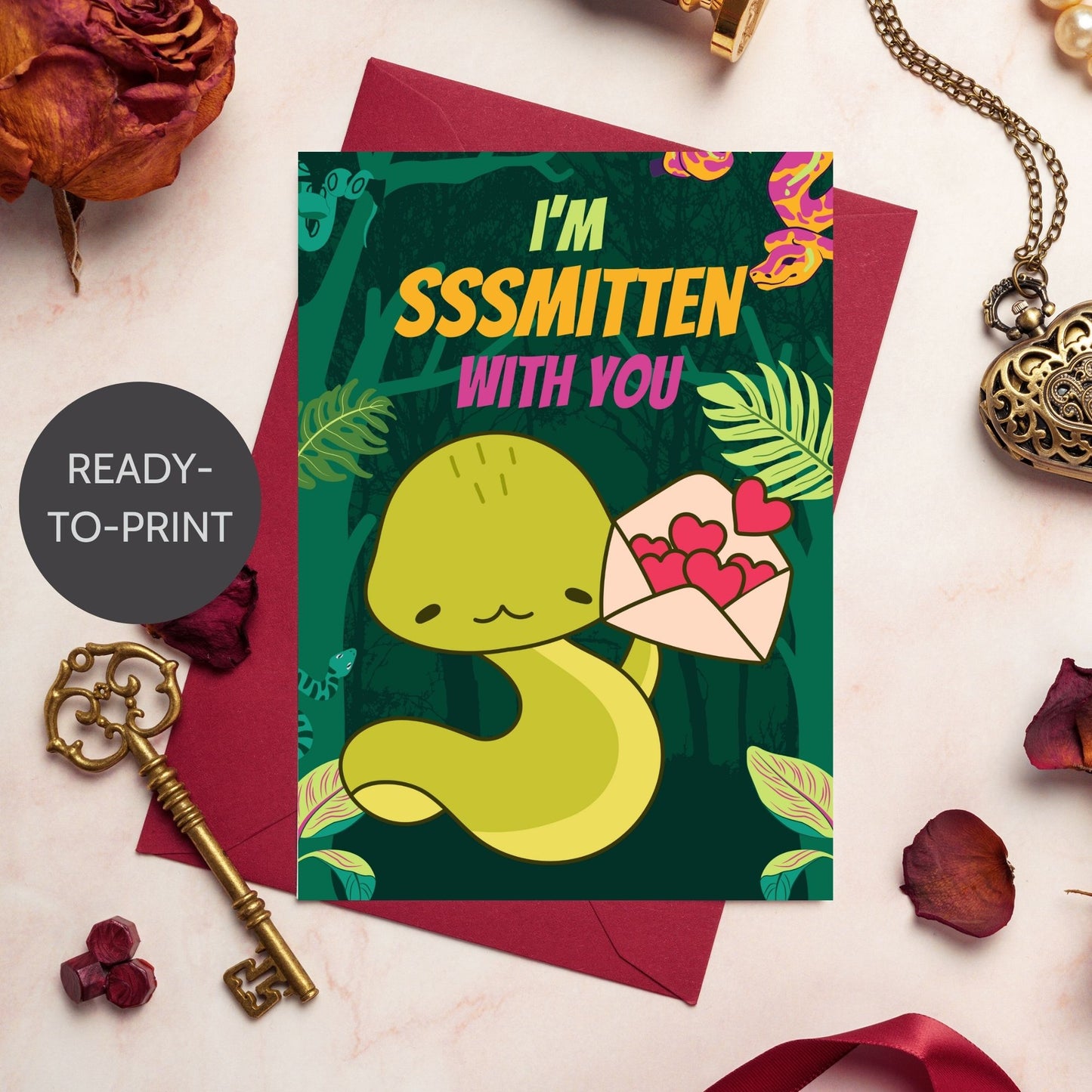 Printable Valentine’s Day Greeting Card featuring the phrase “I'm Sssmitten With You” with a snake theme. Designed as a 5x7 PDF on an 8.5 x 11 sheet with two cards per page. A playful and unique Valentine’s card for snake lovers.