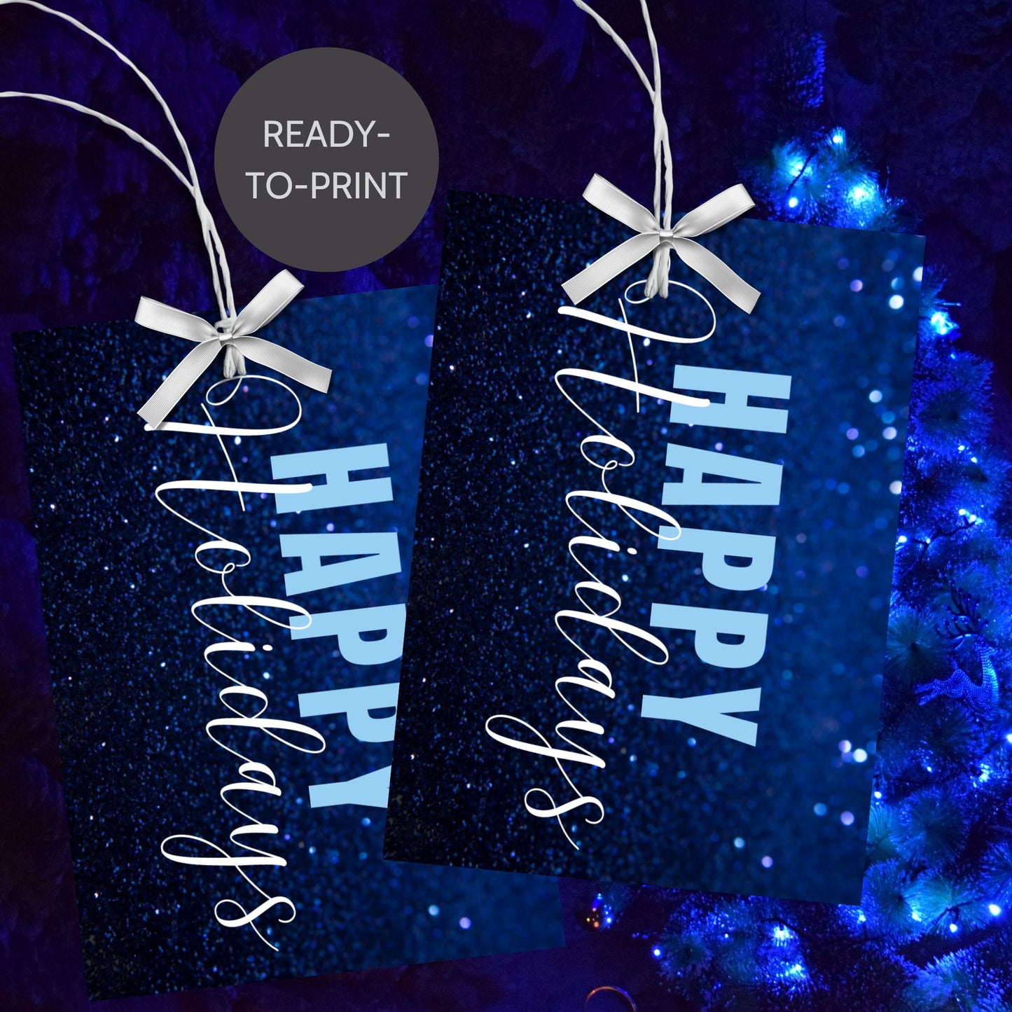 Printable blue Holiday gift tags with a glittery blue background and bold light blue "Happy Holidays" text, sized 2.5 x 3.5 inches, 8 tags per sheet.