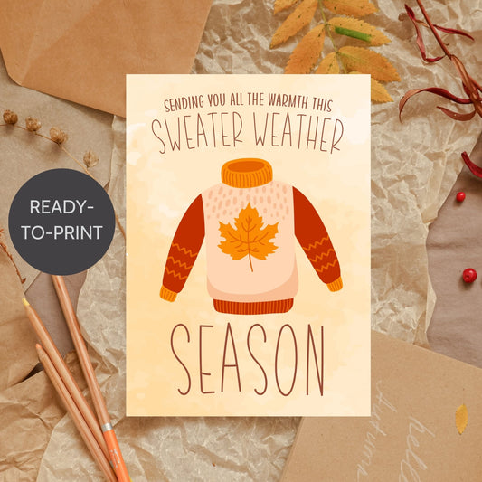 Printable Fall Greeting Card featuring a cozy sweater design with the message 'Sending You All the Warmth This Sweater Weather Season,' set on a warm autumn background.