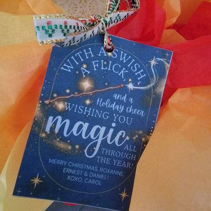 Harry Potter-inspired holiday gift tags featuring a wand, swirling gold magic, and starry background with the message 'With a Swish & Flick and Holiday Cheer, Wishing You Magic All Through the Year.'