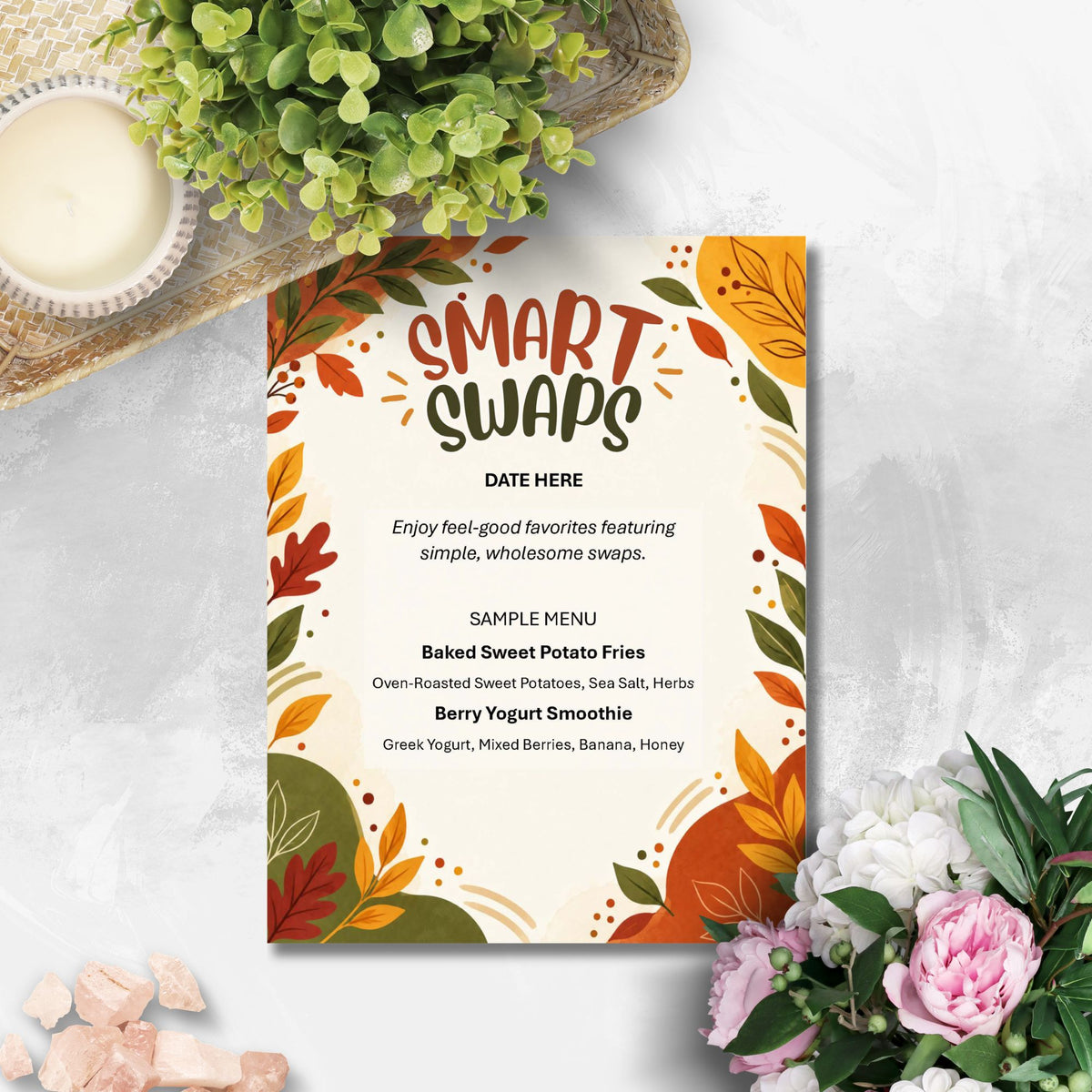 A decorative 'Smart Swaps' menu card with autumn leaf illustrations, styled on a light gray textured surface with flowers, a candle, and greenery around it.