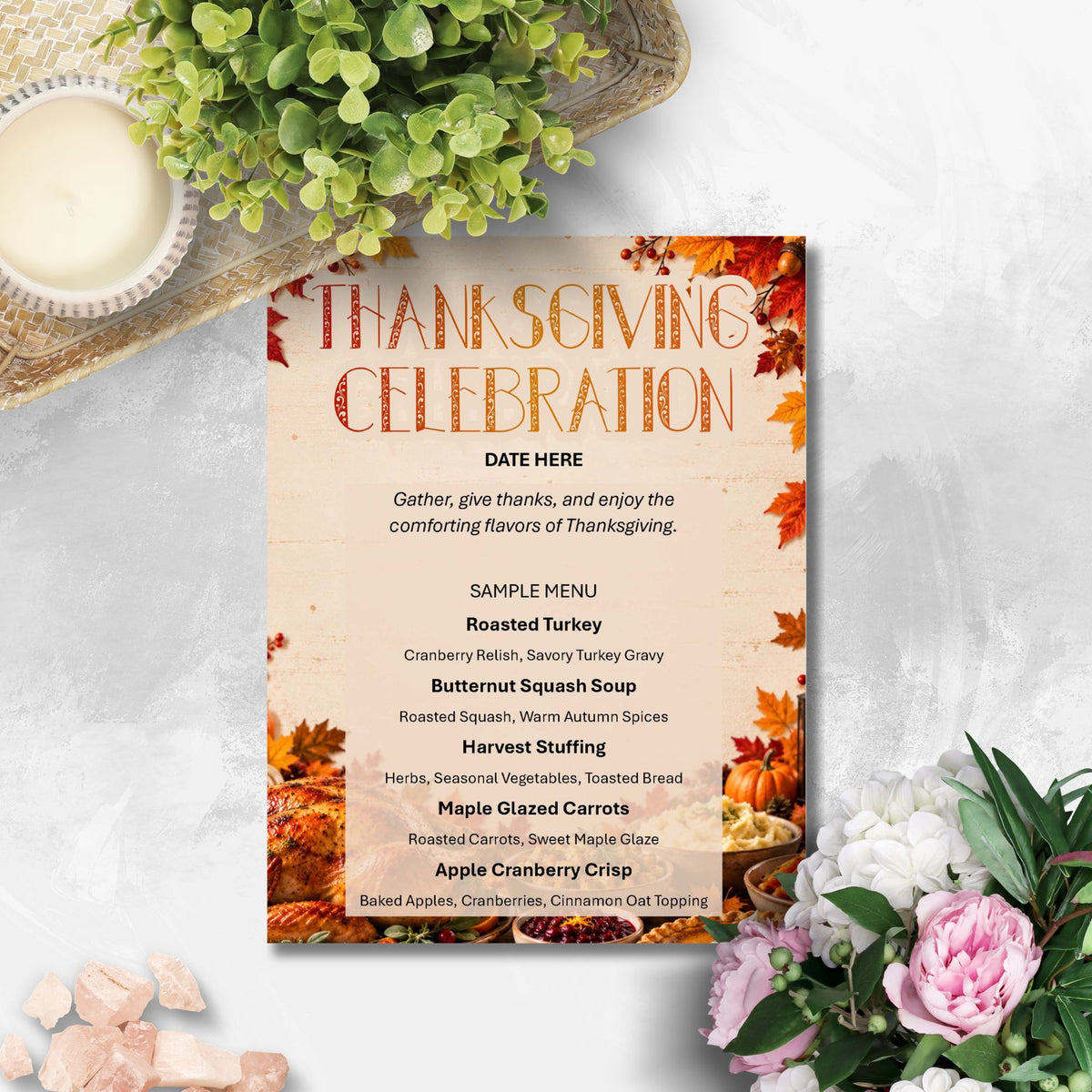 A Thanksgiving-themed menu card styled in a flat-lay arrangement with autumn leaves, pumpkins, flowers, and a candle on a light gray surface.