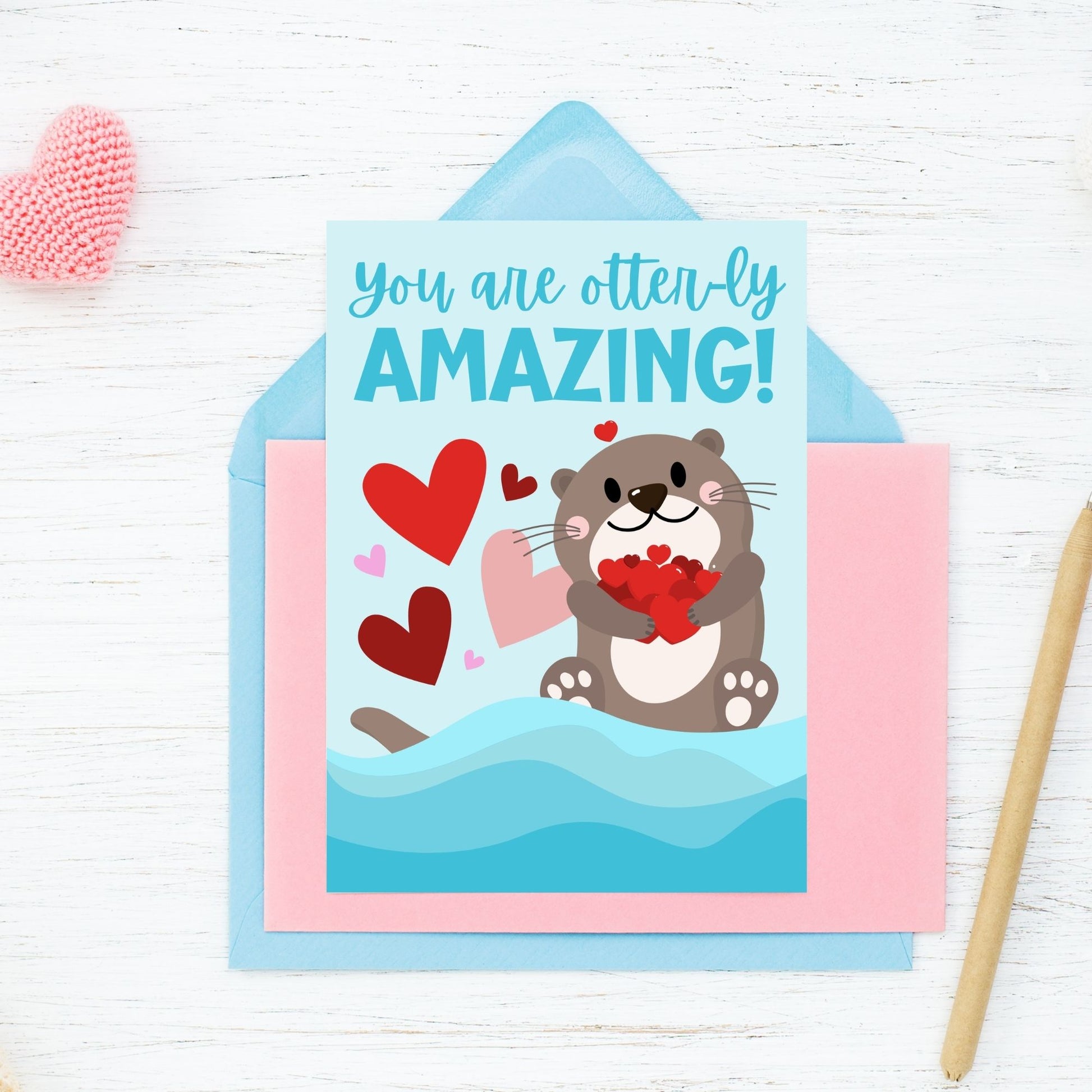 Printable Valentine’s Day Greeting Card featuring the pun “You Are Otterly Amazing.” Designed as a 5x7 PDF on an 8.5 x 11 sheet with two cards per page. A cute and fun Valentine’s card for otter lovers and friends.