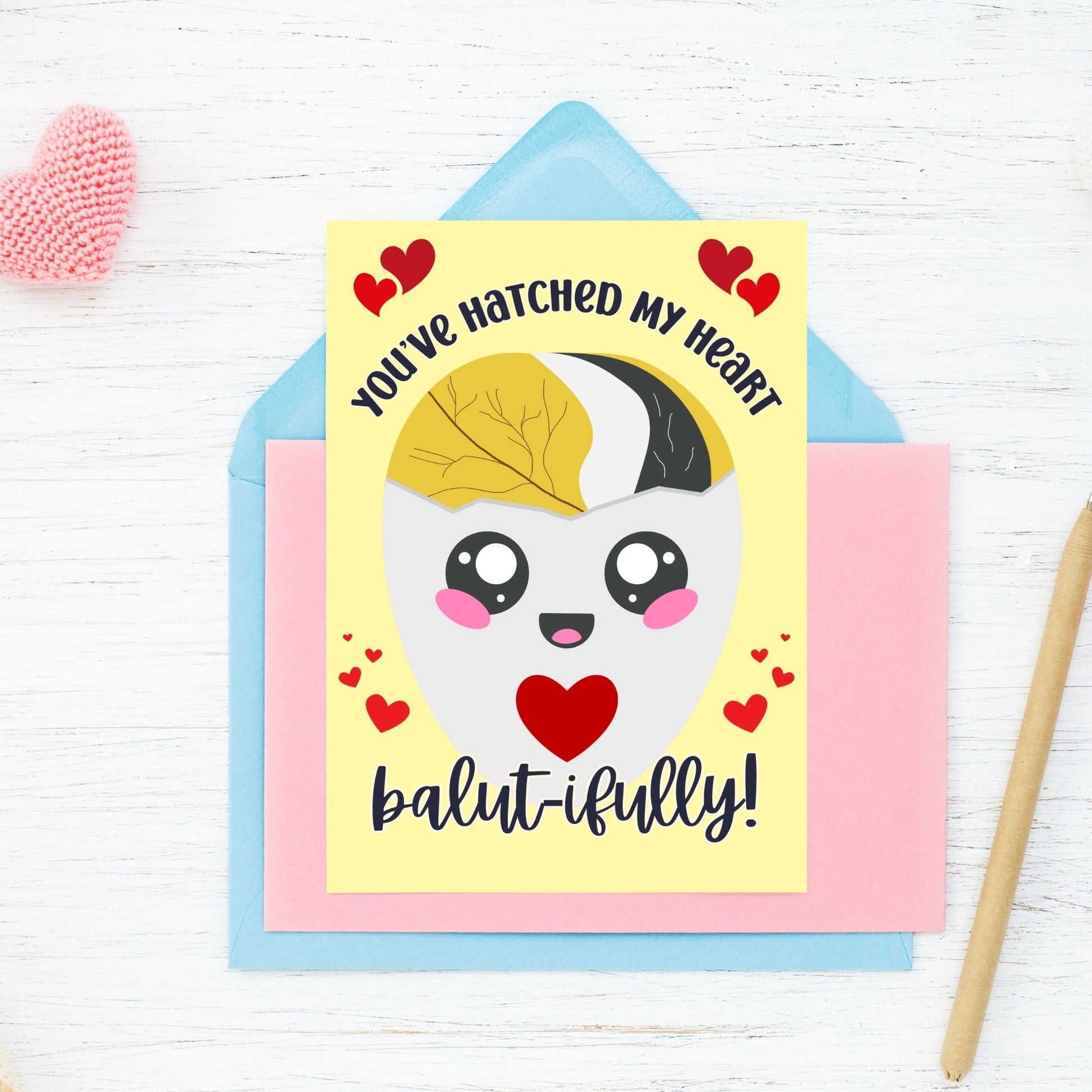 Printable Valentine’s Day card featuring the phrase “You’ve Hatched My Heart Balutifully” with a fun and unique balut (Filipino delicacy) design. Designed as a 5x7 PDF on an 8.5 x 11 sheet with two cards per page. A punny and heartfelt Valentine’s card for Filipino food lovers.