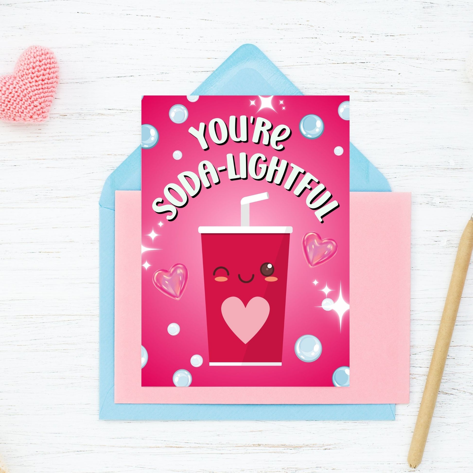 Printable Valentine’s Day Greeting Card featuring the phrase “You’re Soda-lightful” with a soda bottle illustration. Designed as a 5x7 PDF on an 8.5 x 11 sheet with two cards per page. A bubbly and pun-filled Valentine’s card for loved ones.