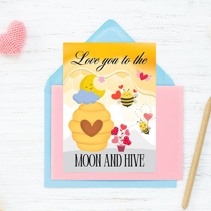 Printable Valentine’s Day card featuring the phrase “Love You to the Moon and Hive” with a bee and moon design. Designed as a 5x7 PDF on an 8.5 x 11 sheet with two cards per page. A punny and heartfelt Valentine’s card for loved ones.