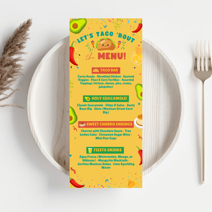 Editable taco-themed tabletop menu card titled “Let’s Taco ’Bout the Menu!” with bright fiesta graphics, customizable in Canva. Sized 3.65 x 8.5 inches for buffet and food station display.