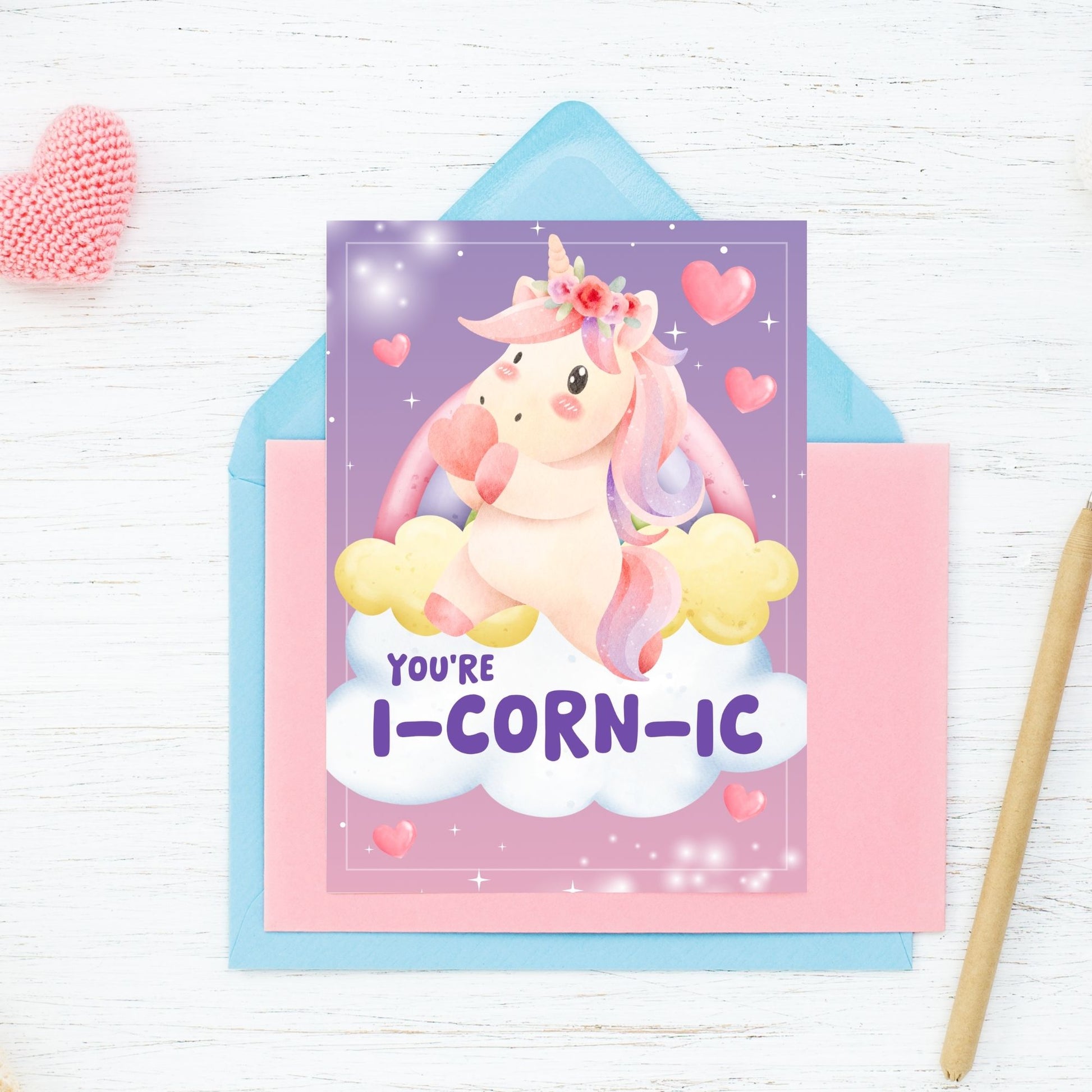 Printable Valentine’s Day Greeting Card featuring the unicorn-inspired pun “You're iCORNic.” Designed as a 5x7 PDF on an 8.5 x 11 sheet with two cards per page. A cute and whimsical Valentine’s card for unicorn lovers.