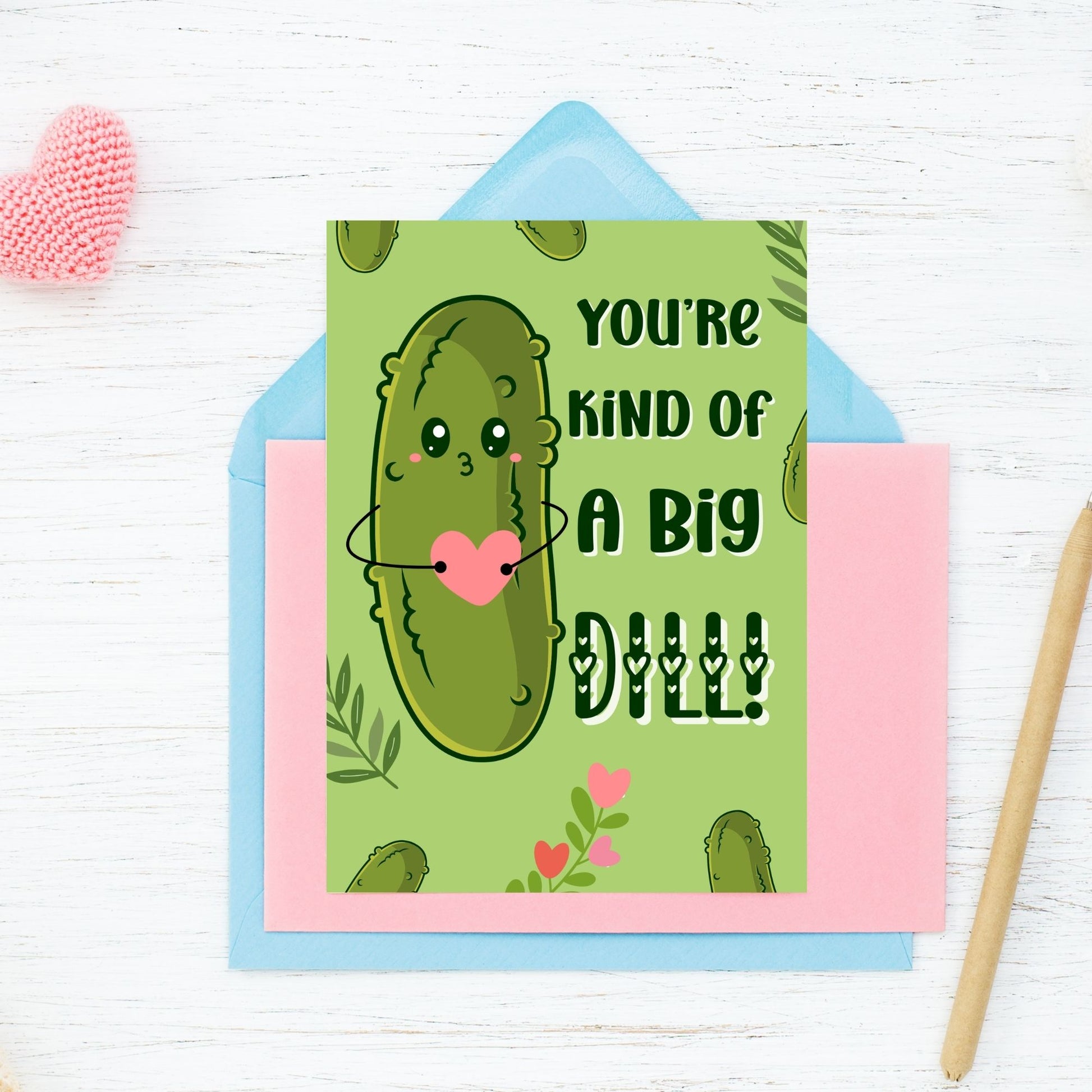 Printable Valentine’s Day Greeting Card featuring the phrase “You’re Kind of a Big Dill” with a fun dill design. Designed as a 5x7 PDF on an 8.5 x 11 sheet with two cards per page. A punny and unique Valentine’s card for loved ones.