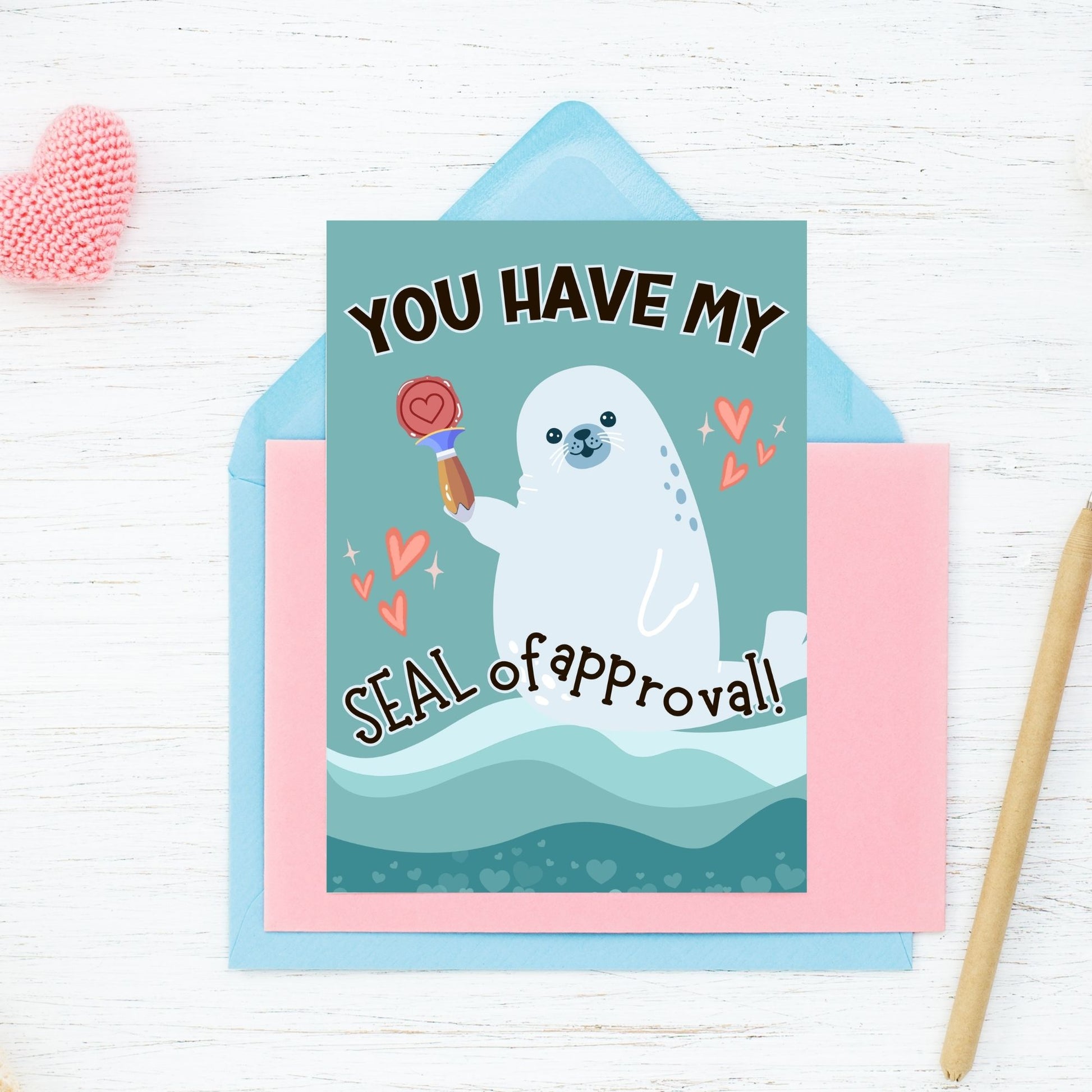 Printable Valentine’s Day Greeting Card featuring the phrase “You Have My Seal of Approval” with a seal theme. Designed as a 5x7 PDF on an 8.5 x 11 sheet with two cards per page. A cute and playful Valentine’s card for animal lovers.